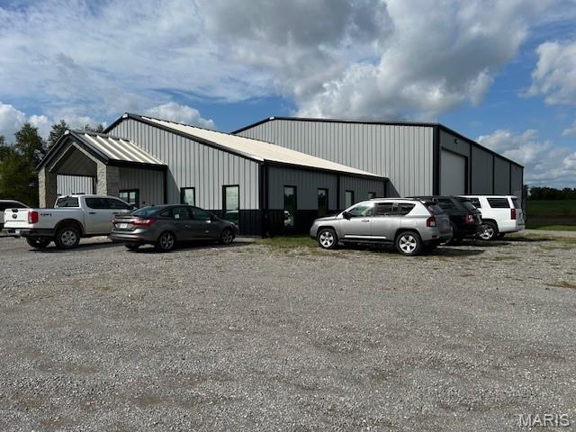 This prime industrial property features a recently constructed 10,400 SF building, with a 2,400 SF high-quality office area and an 8,000 SF shop/warehouse boasting impressive 21' to 26' heights. The property is thoughtfully equipped with private offices, a kitchenette, a conference room, and more, catering to a wide range of business needs. Additionally, it includes a convenient 16' x 21' drive-in truck door and a 10' x 10' loading dock, providing seamless access for logistics operations. Situated on 2.31 acres, this property offers ample space for expansion and outdoor storage, making it ideal for your industrial, warehouse, or distribution needs.  An additional 10 acres is available at an additional cost.
