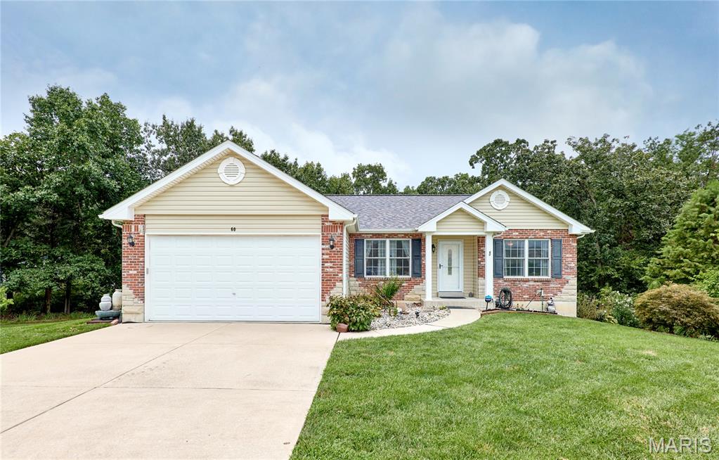 There’s a lot to love on Citori! This exceptionally well-maintained 1,700+ sq ft ranch is tucked away on a quiet cul-de-sac in Troy’s Rockport subdivision on a spacious .526-acre lot with scattered trees and woods along the back for added privacy. Inside, the split-bedroom floor plan offers a bright, open feel with vaulted ceilings in both the living room and primary suite. The inviting living room features a gas-log fireplace and new carpet, while the eat-in kitchen offers granite countertops, abundant cabinetry, and easy access to the separate dining room. The private primary suite feels like a retreat with a spa-like ensuite featuring a soaking tub beneath a large picture window overlooking the backyard and a separate shower. Thoughtful updates include new carpet in the living room and bedrooms in 2026, LVP flooring in 2025, a new roof in 2023, and most exterior doors recently replaced. The deck was replaced in 2020 and freshly re-stained in 2026. Under-decking creates a covered patio below, extending the home’s outdoor living space and providing a great spot to relax or entertain, rain or shine. The walkout lower level includes a bathroom rough-in and plenty of unfinished space ready for the new owner’s personal finishes. Additional features include wiring for a sound system and a convenient location just minutes from Highway 61, shopping, dining, and more.