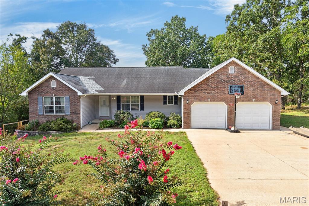 This showstopper of a home is ready for its new owner! Situated on 3.6 wooded acres in the Dixon School District, this spacious 5-bedroom, 3-bathroom home is tucked near the end of Highland Springs Lane, offering a peaceful setting with plenty of privacy.

Step inside to an inviting, open layout connecting the living room, kitchen, and separate dining space, highlighted by hardwood flooring and vaulted ceilings. The kitchen offers stainless steel appliances, a breakfast bar, and plenty of countertop space. Just outside, the covered back deck overlooks the wooded backyard and makes the perfect spot for your morning coffee or relaxing at the end of the day.

The main level features a spacious primary suite with a large closet, along with a separate office space nearby. A split-bedroom floor plan places two additional bedrooms on the opposite side of the home for added privacy.

Downstairs, the finished basement provides even more room to spread out with a huge second living area, the 4th and 5th bedrooms (5th bedroom does not have a window), plus additional storage that makes great use of the space. Outside, the wooded backyard adds even more privacy with plenty of room to explore, play, and enjoy the outdoors, including a little rustic clubhouse for the kids. With space inside and out, a private setting, and a layout designed for everyday living, this one is ready to impress! BONUS: Seller is offering a $13,860 roof allowance at closing, payable to High Up Roofing, giving the new owner the opportunity to have the roof addressed after closing.