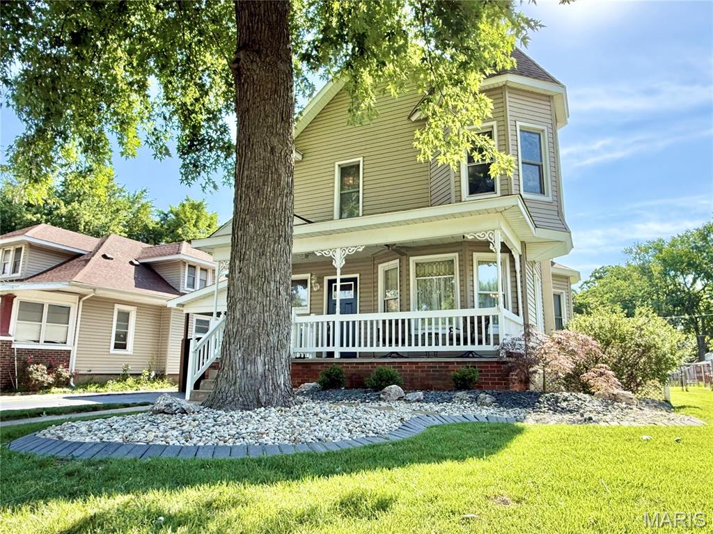 Welcome home to this beautifully maintained 4-bedroom, 2-bath Sears home that perfectly blends timeless character with modern updates. Step inside to find a spacious living room, formal dining room, and updated LVP flooring throughout the living room, dining room, and foyer (2023). The kitchen features new quartz countertops, and the renovated full bath boasts a custom Onyx surround and matching vanity top. Brand new windows installed this week!! 

Convenience abounds with main-floor laundry, pull-down attic stairs, an attic fan, and custom built-in bed and storage drawers in one of the bedrooms. The finished lower level offers additional living space with a large family room, fourth bedroom, and walk-up egress door.

Outside, you'll enjoy a DOUBLE LOT with refreshed landscaping, a covered front porch, screened-in room in backyard, carport, and a freshly resealed driveway—perfect for relaxing or entertaining. Major updates provide peace of mind, including a newer roof, furnace, and water heater. New windows are scheduled for installation next month, adding even more value and efficiency.

This move-in-ready home offers space, charm, and numerous improvements both inside and out. Don't miss your opportunity to make it yours! Occupancy inspection passed! Start packing!!

** Offer Deadline of Sunday, 7/12/26 at 12pm - Response Deadline of 7/12/26 at 2pm. Seller reserves the right to accept any offer before that deadline. **