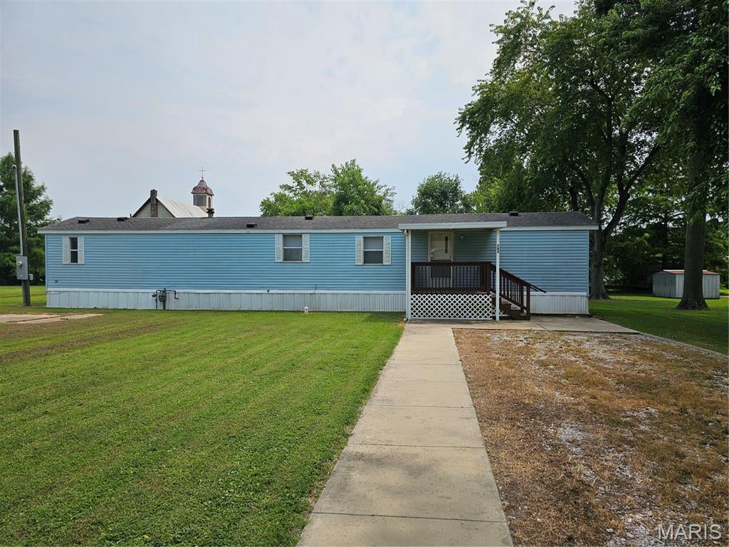 This neat and clean two-bedroom mobile home with 2 full bathrooms, sits on a large lot and offers a spacious kitchen with built in hutch that adds character to this home with A large living room for space and family. Enjoy both a covered front porch and a back deck as well. Perfect for relaxing outdoors. Move-in ready and ideal for a primary residence or an investment for rental property. Call for a showing soon.