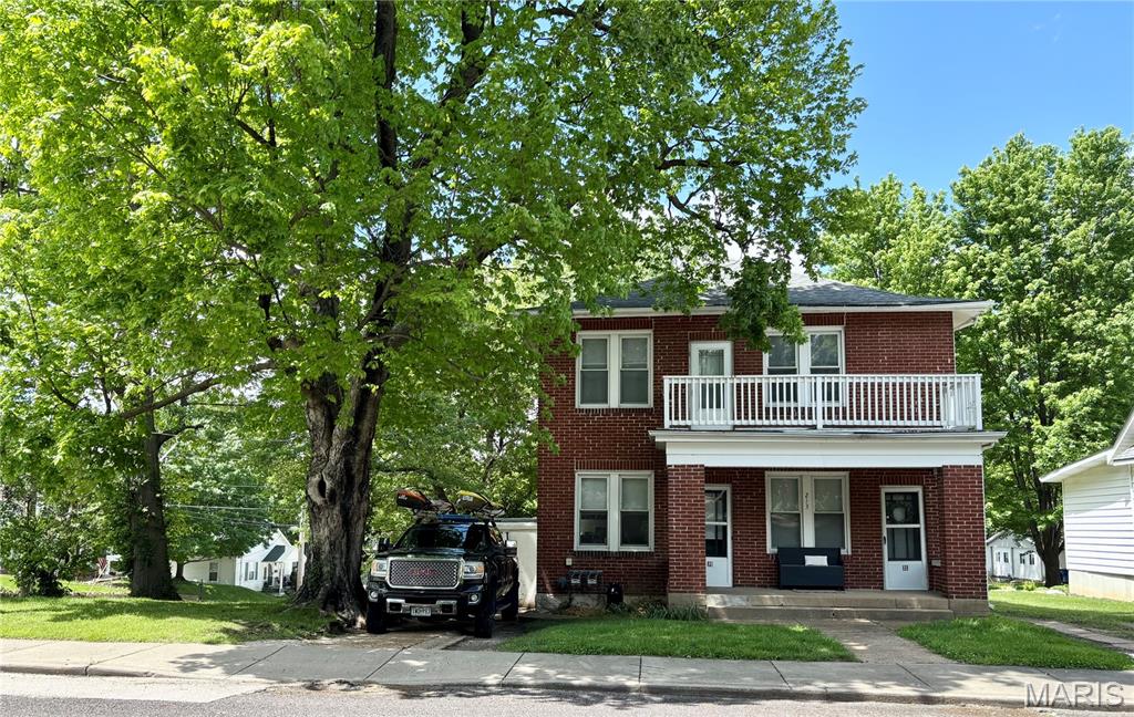 This solid full-brick 2-family home is ready for its next chapter! Endless possibilities here! Each unit features 2 bedrooms, 1 full bath, a spacious living room, and a functional kitchen, with one unit on the main level and the other upstairs for comfortable, private living. The shared basement provides laundry with separate hookups and private access for each unit. The outdoor living is just as appealing, with each unit enjoying its own balcony, a welcoming front porch for both front doors, and a large back yard situated on a corner lot right in the heart of town.  Designated parking for each unit right out front plus a small 1-car garage space on one side-great for storage too! Whether you’re looking to grow your investment portfolio, live in one unit and rent the other, or explore additional opportunities, this property offers flexibility and a fantastic location. Per the City of Washington, with approval of a special use permit, the property could potentially be used as a short-term rental-making it especially attractive for traveling healthcare professionals (right near the hospital!) and visitors alike. Two units, one great opportunity-don’t let this one be the one that got away! This is a duplicate listing of 26016620