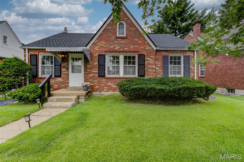 Incredible move-in-ready home that shines with pride of ownership and delivers the total package—inside and out! A handsome brick exterior welcomes you to an inviting, level rear lot featuring a nicely landscaped patio area, cedar privacy fencing with lighting, and a lovely screened porch with louvered glass—a versatile bonus space for relaxing or entertaining. The long driveway provides abundant parking and leads to a detached garage with an updated door and low-maintenance vinyl siding. Recent improvements include an upgraded architectural roof (2023) and chimney liner and tuckpointing. Inside, streaming natural light fills the home, highlighting gleaming wood floors, charming archways, gorgeous stain package and baseboards, an impressive front door, fresh neutral paint, 2" faux-wood blinds and upgraded ceiling fans. The spectacular updated kitchen features Amish white cabinetry with crown molding, farmhouse sink with gooseneck faucet, stainless appliances including a 5-burner stove and recessed lighting. The vintage-designed main bath offers a newer medicine cabinet and refreshed tub. Upstairs expands the living space with brand-new plush carpet, 3rd bedroom, 2nd full bath and loft bringing the total to 1,306 finished square feet. The sparkling-clean basement provides storage shelving and PVC plumbing and showcases an upgraded HVAC system with smart thermostat (2023). Beautifully maintained, thoughtfully updated, and ready to enjoy—everything on your wish list is here. Don't delay!