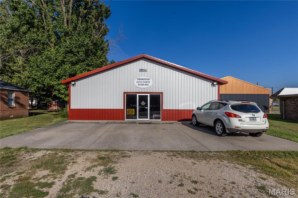 Commercial opportunity in Dexter, Missouri offering approximately 7,600 sq ft of usable space. The property features a 1,200 sq ft storefront with a wall-mounted heating and cooling unit, plus a two-level warehouse with approximately 3,200 sq ft on each level. The warehouse offers concrete flooring and extensive shelving, parts bins, and storage organizers. All existing parts, shelving, and organizers are included with the sale, providing an excellent setup for a parts business, warehouse, shop, storage facility, or a variety of other commercial uses. Built in 2000 and conveniently located with good visibility and access. Priced at $310,000, this property offers an impressive amount of commercial space for the price.