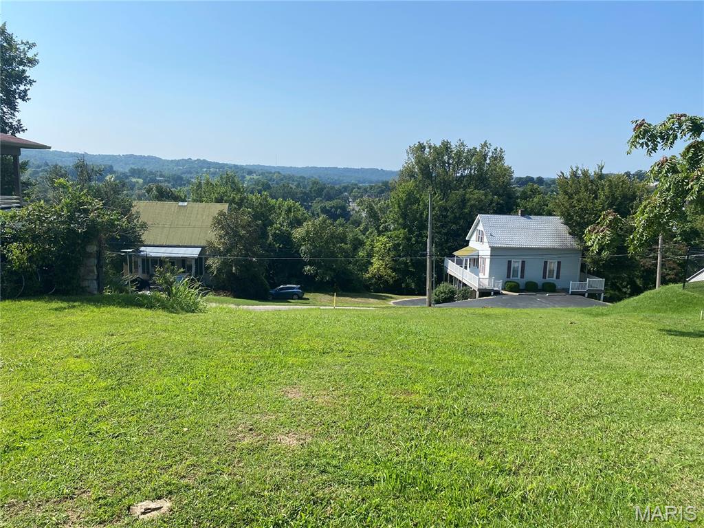 Hermann City Lot with a View! Vacant building lot located in a wonderful, residential area overlooking the Southern side of town! This full city lot, measuring 60' x 120', provides a excellent spot for your new home. It's located on a beautiful residential lot surrounded by other nice homes and mature trees. This area is nicely walkable with sidewalks and lots of shade. If that perfect home just isn't out there on the market for you, here's your spot for your brand new custom build!