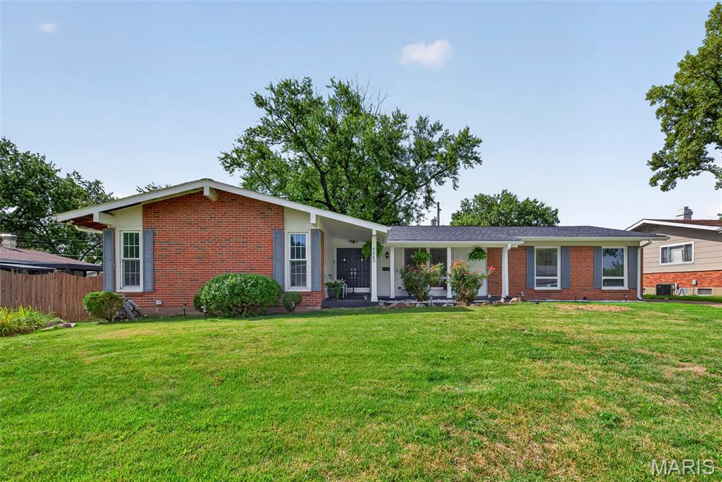 Beautifully updated and move-in ready, this spacious 3-bedroom ranch offers stylish updates, comfortable living spaces, and more than 1,000 additional square feet of finished living space in the lower level. Brand-new luxury vinyl wood flooring and fresh neutral paint create a clean, timeless backdrop for any décor. The gorgeous kitchen features custom cabinetry, a center island with granite countertops, tile backsplash, and stainless steel appliances, including a gas cooktop, double ovens, dishwasher, microwave, and refrigerator that stays. The kitchen opens to the family/hearth room, where a cozy wood-burning fireplace creates the perfect gathering spot, with a slider leading to the level, fully fenced backyard and brick patio. A second main-level living area flows into a formal dining room, which is fully furnished and includes a dining set that stays with the home. The spacious primary suite features a beautifully updated en suite bath and walk-in closet, while two additional generous bedrooms—each with a ceiling fan—share another updated hall bathroom. Downstairs, the finished lower level adds incredible versatility with a large recreation room complete with a pool table, wall-mounted TV, and bar, all staying with the home, plus a finished bathroom. A bonus room with storage and two closets is ideal for a home office, exercise area, workshop, or whatever space you need. There is also plenty of additional storage throughout. Outside, mature trees provide privacy and shade, while the fenced backyard offers a wonderful space to relax and entertain. Major updates include a NEW roof and lower level carpet in 2025, plus NEW HVAC, water heater, LVP flooring, and interior paint in 2026. Conveniently located near Duenegant Park, James J. Eagan Community Center, shopping, restaurants, and everyday amenities. This one is truly ready to enjoy!