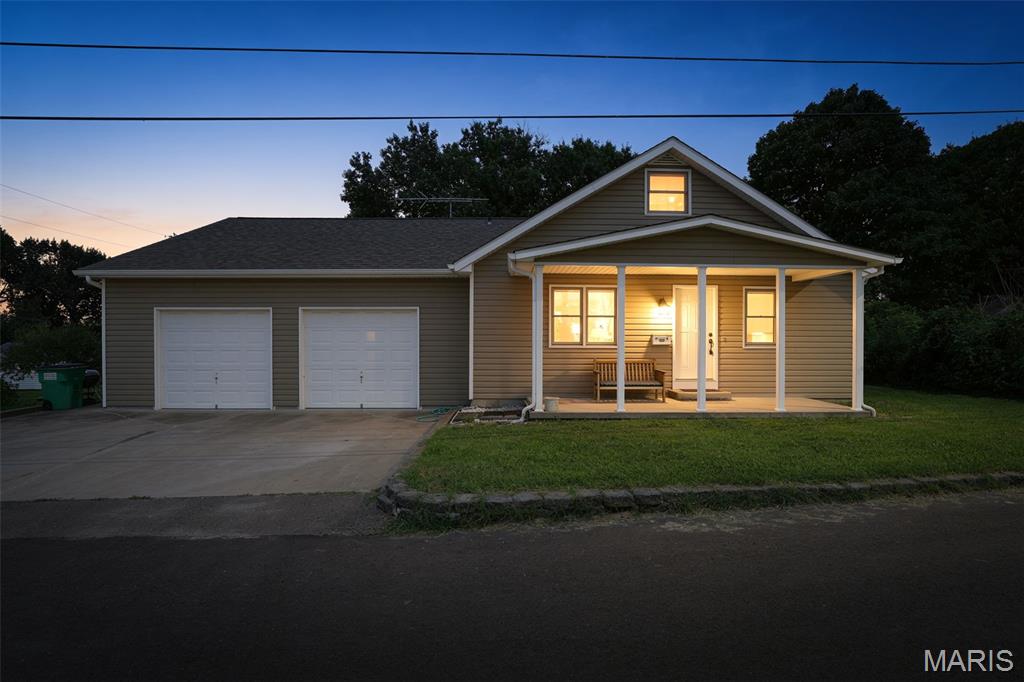 Prepare to be surprised by all the space and versatility this charming home has to offer! Featuring approximately 2,700 finished square feet, this spacious property offers 4 bedrooms, 3 full bathrooms, and room for everyone. Originally built in 1929, the home underwent a major renovation in 1990, including a new foundation while preserving the character of the original structure.

The main level features a generous living room, a convenient primary bedroom, and a beautiful country kitchen complete with a large center island and all appliances included. Upstairs, you'll find three additional bedrooms, a full bath, and one bedroom with an oversized walk-in closet. An additional flex space provides endless possibilities for a playroom, home office, hobby room, or sitting area.

The finished walk-up lower level expands your living space with a large family room featuring a cozy ventless gas fireplace, a full bath, laundry area with washer and dryer included, and a potential fifth bedroom (non-conforming with no egress window).

Outside, you'll appreciate the oversized two-four car garage .  14' x 24' outbuilding with electricity, and an additional 10' x 10' storage shed—perfect for hobbies, a workshop, or extra storage.

Conveniently located directly across from the public school campus and within easy walking distance of downtown amenities, this home combines space, functionality, and an unbeatable location. With so much to offer, this is truly a home you need to see in person!