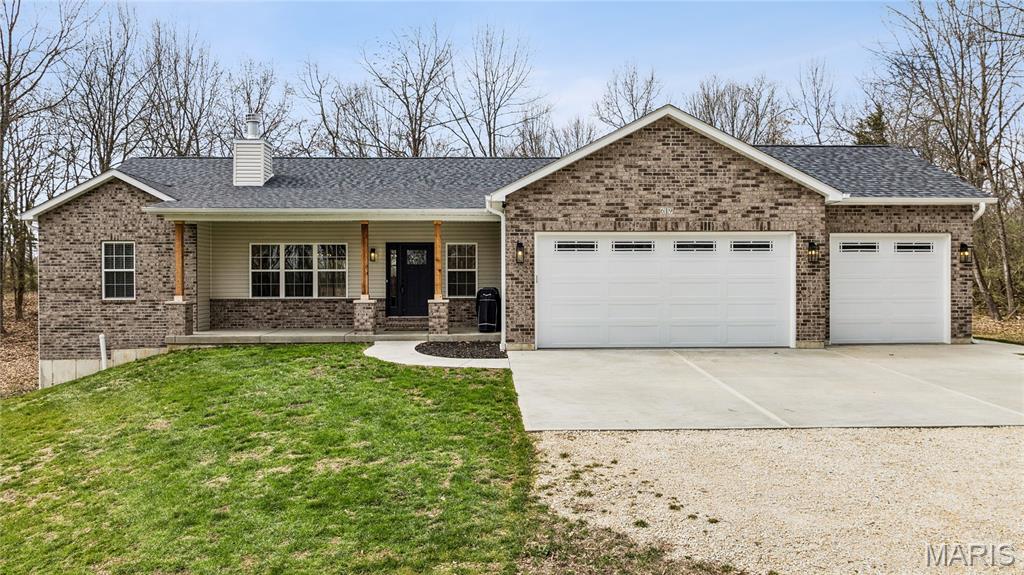 Built to be a forever home, an unexpected job relocation has created a unique opportunity for the next owner. Enjoy peaceful country living in this beautiful nearly new ranch home set on three private acres “NOT” in a subdivision. Thoughtfully designed and built with a custom kitchen at its heart, the open-concept main living areas are filled with natural light, creating a bright and welcoming atmosphere. This move-in-ready property offers the rare opportunity to enjoy the benefits of new construction without the wait. Ranch home sitting on 3 acres & "NOT" in a subdivision, public water, gateway fiber internet & only minutes from Hwy 70 & 79. Exterior offers partial brick front, covered front porch, vinyl siding to grade, enclosed soffits & fascia, 20 x 14 covered patio with ceiling fan & can lights, partial fenced yard, coach lights & a 3 car oversize garage with wet sink, service door & 8 ft garage doors plus less than a 10th of a mile off the black top road. Interior offers 3 bedrooms & 3 full baths plus one half bath, vaulted & 9 ft ceilings, wood burning fireplace, 2 inch blinds in bedrooms, ceiling fans, luxury vinyl plank flooring, carpet in bedrooms, can lights, main floor laundry room with cabinets & soft close doors & drawers, white trim & panel doors plus 5 1/4 baseboards. Kitchen offers custom wood cabinets with soft close doors & drawers, center island, stainless appliances, tile backsplash, walk-in pantry & granite counter tops. Master suite with walk-in closet & master bath with double sinks & walk-in shower* Side walkout basement with full bath completed by the builder, Aquasana whole home water treatment system, Aquasana whole home water softener, Lennox furnace & 50 gallon Bradford White hot water heater. This one is a pleasure to show