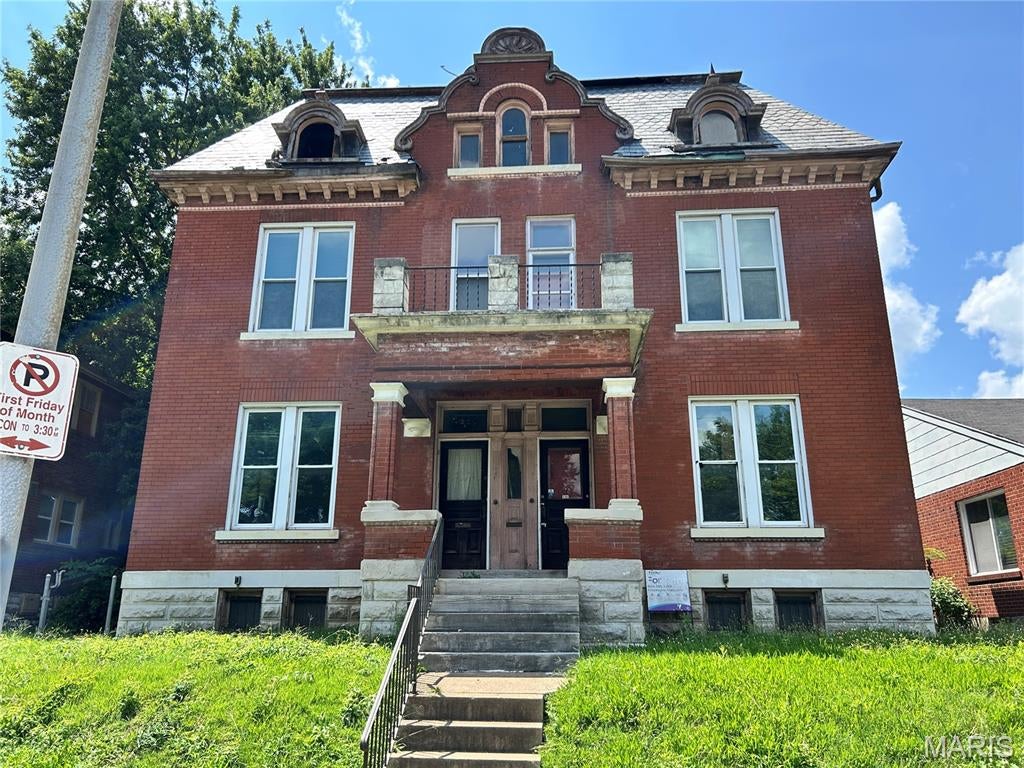 Bring your vision to this rare opportunity to restore and reimagine a substantial all-brick duplex with an partially finished third level offering even more potential. Whether you're an investor looking for your next value-add project or a buyer searching for exceptional space, this property delivers possibilities that are increasingly difficult to find.

The existing layout offers the potential for a spacious 3-bedroom lower unit and a 4-5 bedrooms upper unit, with the partially finished third level (buyer to verify all intended uses and square footage). Much of the original millwork, interior doors, and 4" baseboards remain in place, preserving the character and craftsmanship of this early 20th-century property.

For investors, this is an ideal Fall/Winter renovation project with multiple exit strategies. Renovate and hold as a duplex, reposition for increased rental income, explore shared housing or other residential investment models (subject to zoning and municipal approval), or investigate adaptive commercial or care-related uses where permitted. St Louis City's relatively low property taxes, strong demand for affordable housing, and long-term appreciation potential make this an attractive opportunity for those seeking to build wealth through real estate.

For owner-occupants, imagine transforming this expansive property into a home designed around your family's needs. With the potential for 5-8 bedrooms, there's room for a growing or multi-generational household, dedicated home offices, hobby spaces, and more. Bring your ideas, select your finishes, and create a one-of-a-kind residence that reflects your vision.

The property requires a comprehensive renovation and is being sold strictly **AS IS**. Cash, hard money or commercial financing only. Buyer should conduct all desired inspections for informational purposes and verify all measurements, square footage, zoning, occupancy requirements, permitted uses, and any redevelopment plans prior to closing.

Opportunities to acquire a property of this size, character, and redevelopment potential are uncommon. Schedule your showing today and discover what's possible.