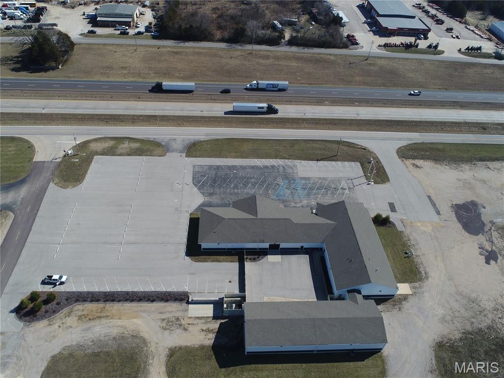 Exceptional commercial opportunity offering over 18,000 square feet of versatile space on approximately 11 acres with outstanding visibility along Interstate 44. Designed with flexibility in mind, the property features a combination of professional office space, large open gathering areas, and warehouse space, making it well suited for a variety of commercial or institutional uses. High-end finishes throughout the building create a professional, move-in-ready environment, while 141 paved parking spaces provide ample capacity for employees, clients, or visitors. The size, layout, and prime interstate location make this an excellent fit for professional services, a church or ministry, educational or training facilities, corporate headquarters, medical or office users, or other organizations seeking a highly visible, functional property with room to grow. Properties of this size, quality, and location are rarely available. Schedule your private tour today.