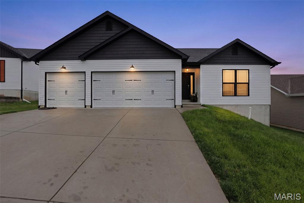 CERTIFIED PRE-OWNED HOME! Inspections DONE! Occupancy DONE! Quick closing available! 
Sometimes the right opportunity comes along at the wrong time for a seller — and that creates the perfect opportunity for someone new. At 1074 Daltons Way in Festus, this nearly new ranch home was meant to be a forever home, thoughtfully chosen and upgraded with comfort, style, and everyday living in mind. Now, with a career move calling the current owners away, the next chapter is ready to begin here.

Set within one of Festus’ newer neighborhoods, this home immediately feels welcoming from the moment you pull into the oversized driveway. Craftsman-inspired details, attractive exterior color contrast, and the three-car garage create a clean, polished curb appeal that stands out while still fitting naturally into the neighborhood. The streets here have a sense of community that’s hard to manufacture — neighbors outside in the evenings, holiday lights glowing throughout the subdivision in winter, and one of those rare places where Halloween still feels like an event everyone looks forward to.

Inside, the home opens into a bright and airy floor plan with vaulted ceilings and wide sightlines that make the space feel even larger than its already generous 1,436 square feet. Natural light pours through the windows and reflects beautifully off the modern finishes, creating a warm, inviting atmosphere throughout the day.

The kitchen is truly the centerpiece of the home — designed for gathering, conversation, and connection. Rich 42-inch cabinetry stretches upward toward the vaulted ceiling, paired with granite countertops, stainless steel appliances, subway tile backsplash, and stylish pendant lighting. The oversized center island offers seating, prep space, and the kind of layout that naturally becomes the hub of everyday life. Whether it’s coffee in the morning, weeknight dinners, game-day snacks, or hosting friends during the holidays, this space was built to be lived in and enjoyed.

Just beyond the kitchen, the dining area overlooks the backyard through sliding glass doors, bringing in soft natural light and offering easy access for grilling or outdoor dining. The open-concept living room continues the welcoming feel with soaring ceilings, durable flooring, and a fireplace feature wall that gives the room warmth and character.

The primary suite is privately positioned toward the back of the home, creating a relaxing retreat at the end of the day. The spacious bathroom includes a double vanity, separate shower, and a garden tub set beneath a rain-glass privacy window that fills the room with natural light while maintaining privacy. Additional bedrooms are comfortably sized and versatile for guests, hobbies, office space, or everyday living.

One of the most exciting features of this home is the lower level. The basement features a full 9-foot pour, giving it an open, comfortable feel that avoids the typical closed-in basement atmosphere. With an egress window already in place for a future legal fourth bedroom, the possibilities are extensive. Recreation area, home theater, gym, game room, additional living quarters, second kitchen setup, or expanded entertaining space — all ready for your vision whenever the time is right.

Living in Festus offers the balance many buyers are searching for: a community atmosphere with convenient access to shopping, dining, schools, parks, and recreation. Main Street Festus brings local restaurants, seasonal events, and small-town charm just minutes away, while nearby parks and walking trails provide opportunities to enjoy the outdoors year-round. The location also keeps daily conveniences close at hand with a residential feel that makes this neighborhood so appealing.

This is the kind of home that feels comfortable the moment you walk through the door — modern without feeling cold, spacious without wasted space, and thoughtfully designed for both everyday living and future possibilities.
