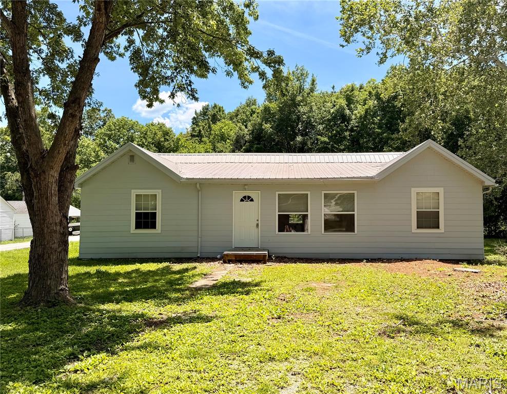 Crisp, clean and newly remodeled, this is truly a turn key home! Located on West 7th Street in Fulton, Missouri, this spacious 4-bedroom, 2-bathroom home with over 1500+ sq ft is perfectly positioned for convenience and lifestyle. Just steps from Westminster College and two blocks from McIntyre Elementary School, this property is ideal for a variety of uses: to make your own home while knowing it’s in a wonderful location that would also later be outstanding as a rental property or as a comfortable home for college students attending Westminster or William Woods University.
The open-concept floor plan (newly remodeled) offers plenty of room to spread out, with natural light pouring in and making the space feel bright, airy, and even more inviting, with new flooring and fresh paint throughout giving the home a clean, modern feel. The remodeled kitchen is a true highlight, featuring brand new butcher block countertops and a large island perfect for bar seating or a breakfast bar making it a natural gathering space for everyday living and entertaining. A nonconforming fourth bedroom adds incredible flexibility, serving equally well as a family room, home gym, theater room, or whatever suits your needs.
Stinson Creek Trail is within walking distance, providing outdoor exercise and recreation right at your doorstep. Whether you're an investor looking for a high-demand rental in a prime location, a family seeking a move-in ready home, or a student looking for the perfect place to room during your college years, this property checks all the boxes.
Fulton is a vibrant college town, home to Westminster College and William Woods University, and a regional hub for employment. Major area employers include the Fulton State Hospital, the public school district, the universities, Walmart, and the Ameren Callaway Nuclear Plant about 13 miles southeast. For commuters, downtown Jefferson City is roughly 25 miles southwest (about 30 minutes), placing state-government jobs within easy reach, while Columbia lies about 25–30 miles to the west (around 30–35 minutes), offering the University of Missouri, major medical centers, shopping, and dining.

Property to be Sold As Is, See attached rider that should be attached to all incoming contracts. It is a nice home and newly remodeled the seller will not fix a laundry list of small items, Buyers may do any inspections at the showing time but schedule the showing accordingly - Appliances to convey with the sale: Seller to Install stainless steel appliances prior to closing, please place this in your contract if you want the Seller to choose appliances if not the seller will offer a $1,000 credit if the Buyers decide to choose it themselves. 
Square footage is approximate; buyers should verify all measurements, room counts, online data, zoning, and school assignments independently. Prospective buyers, please ensure you have a preapproval letter or proof of funds ready before scheduling a showing.