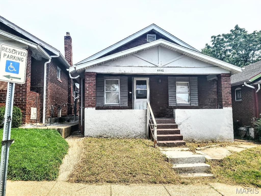 All brick bungalow, 2 bedrooms, 1 bath, full basement, main floor bonus room. Some updated windows. Nice street, nice north city area in the Penrose Park corridor. Very close to highway 1-70/44.  Big rooms. Needs rehab and would make a great rental. Call your real estate professional to walk you thru.