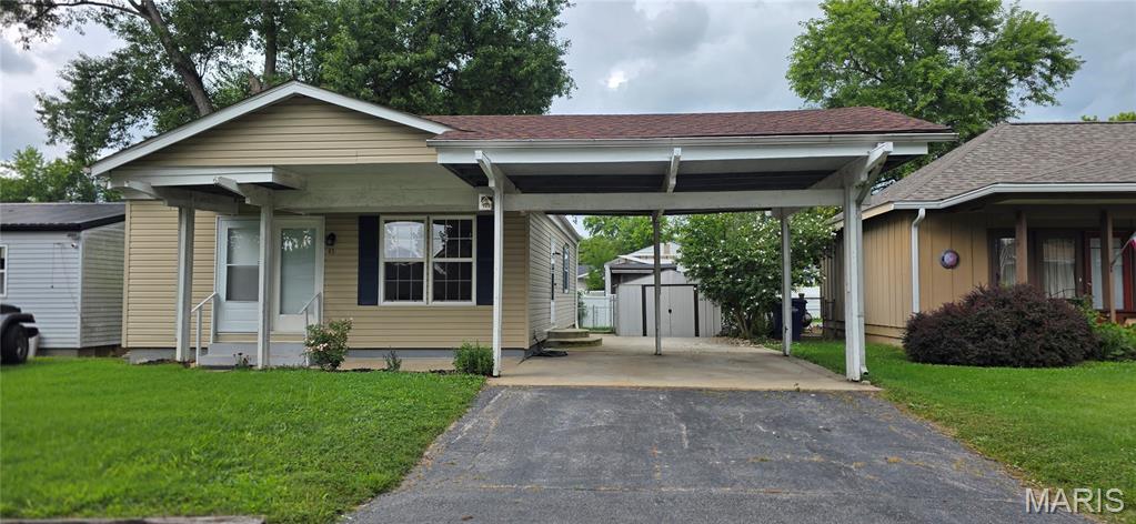 Sold as-is, seller to do no repairs or provide occupancy/inspections.

A place to call home awaits you! Admire the detailed wainscotting in your living room as you walk through the front door or carport door. Hall bedrooms share a full bath across the hall - including a shower and bathtub. Primary bedroom is complete with its own private bathroom. Space for storage available in the unfinished basement or in the shed outside. Spacious backyard with a fire-pit. Roof and electrical panel were replaced in 2022. This home is a move-in ready; a blank slate ready for you to transform!