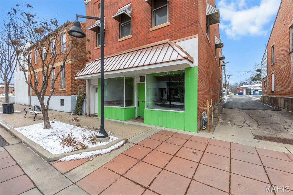 Discover a versatile investment opportunity on Broadway! The upper level features a beautifully remodeled 1 bedroom apartment complete with hardwood floors, exposed brick accents, and a private entrance...perfect for rental income or an owner occupant. The street level commercial space offers excellent visibility with prominent Broadway frontage and expansive display windows, ready to be reimagined and finished to suit your business or tenant needs. So much potential in a prime location!