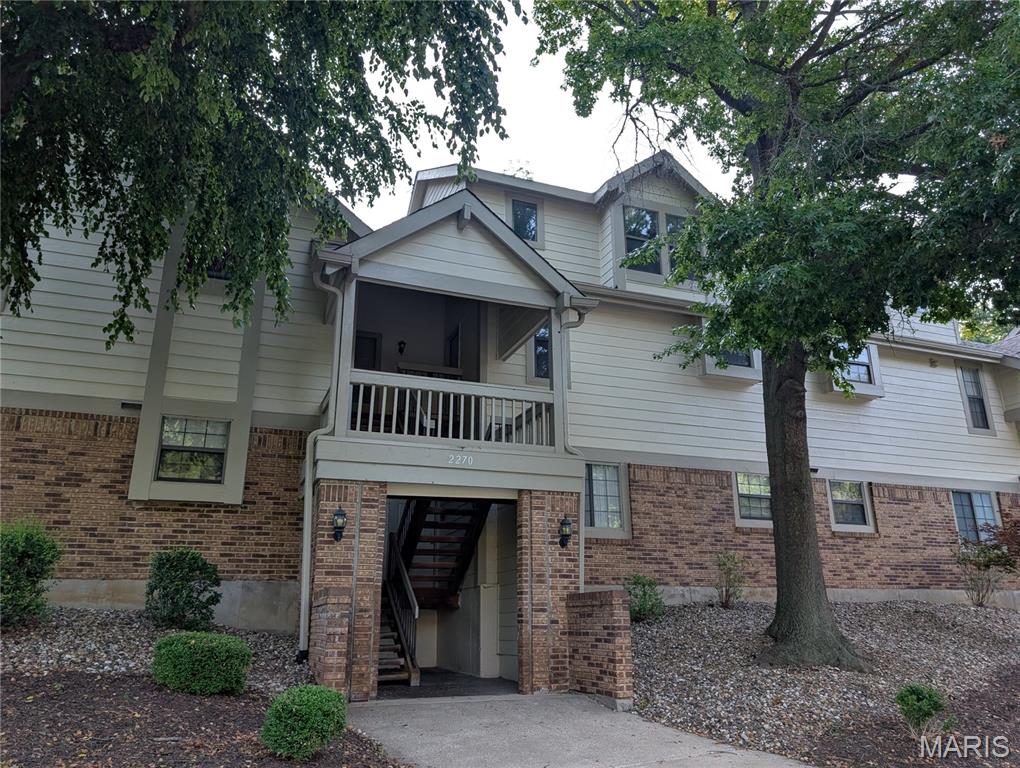Come Play! Secluded, surrounded by nature and close to everything! Terrific 3 bedroom, 2 full bathroom townhome has one of the largest floor plans in Parkside – over 1400 sq feet. The two-story vaulted ceilings make the townhome feel even bigger. The Great Room has a view of the woods and a real wood-burning fireplace. The open floor plan is both grand and cozy. The balcony is private and peaceful and has a view of the woods. This unit is surrounded by nature. Generous bedrooms on both levels and full baths on both levels! The upper bedrooms feel like you are sleeping in a tree house, except better with the full bath steps away! Abundant closet space even the balcony and carport have storage. Newer heating unit and newer dishwasher. Refrigerator, washer and dryer stay.  The carport is at the very end of the structure, leaving plenty of space to spread out. This unit is also steps from a small parking area, perfect for guests. The monthly HOA covers a TON of amenities (pool, clubhouse, insurance, water, sewer, trash, landscaping, snow removal). This property is just minutes from Creve Coeur Park, Westport Plaza and major highways. Lots of greenspace and ALL of Creve Coeur Park at your doorstep!