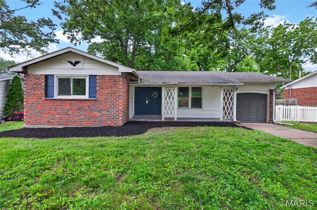 Solid mid-century ranch in Florissant's established Wedgwood neighborhood, offering 3 bedrooms, 2 full baths, and 1,565 square feet on a quarter-acre lot. This home has had a real head start on updates and is ready for the right buyer to finish it out and make it their own.

Inside, you'll find hardwood floors through the main living areas, a fresh coat of paint throughout, and new carpet. The kitchen has been updated with an island and offers a great footprint to build on. Both bathrooms have been refreshed with new vanities, toilets, and fixtures. A sunroom with exposed-beam ceiling adds flexible bonus space, and the living room is anchored by a classic fireplace.

The full basement has been walled in, freshly painted, and given clean, sealed floors — a dry, usable blank slate ready to be finished into the additional living space you envision, whether that's a rec room, home theater, or workshop. Additional features include a one-car attached garage, a storage shed, central air, forced-air gas heat, mature trees, and no HOA. Ferguson-Florissant R-II schools.

This home appreciates the reliable bones of a 1964 build and has the heavy lifting started — bring your vision and finish the story.