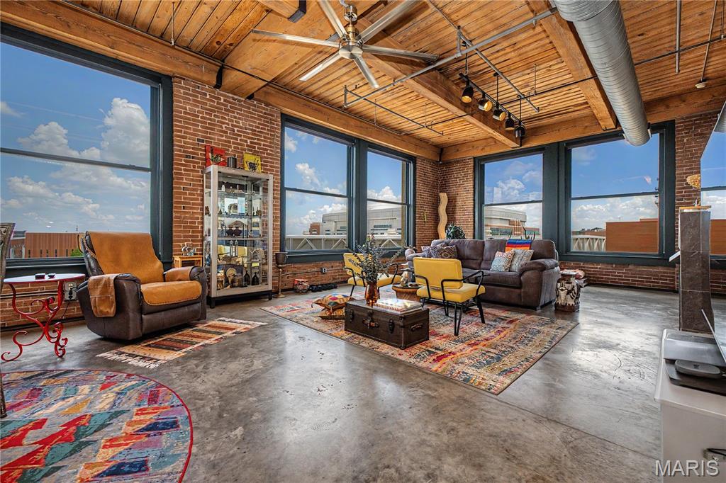Experience the perfect blend of historic charm and modern downtown living, located in the heart of vibrant St. Louis, Missouri. This stunning 2-bedroom, 2 full bath loft offers an expansive 2,013 square feet of open-concept living space designed for both comfort and sophistication. Soaring ceilings, oversized windows, and the character-rich architectural details create an inviting urban retreat filled with natural light. The spacious living area is anchored by a cozy fireplace, adding warmth and ambiance to the loft’s industrial-chic aesthetic. The thoughtfully designed kitchen and entertaining spaces flow seamlessly, making this home ideal for hosting guests or enjoying quiet evenings in the city. The generously sized bedrooms provide comfort and privacy, while the convenience of an in-unit washer and dryer elevates everyday living. BONUS for the New Buyer...........Brand - New: HVAC, range, refrigerator, dishwasher, and microwave. Residents also can enjoy the 2 roof top deck areas, workout room, and 1 assigned parking space in the secure parking garage. As an added bonus, high-speed fiber internet and Fiber Optic cable are included in the HOA, offering exceptional connectivity for work, streaming, and modern lifestyles. Perfectly positioned near some of downtown’s best restaurants, shops, entertainment venues, and nightlife, this location places you in the center of it all while still offering the comfort of a private retreat. Luxury loft living, modern conveniences, and unbeatable walkability—this is downtown St. Louis living at its finest.