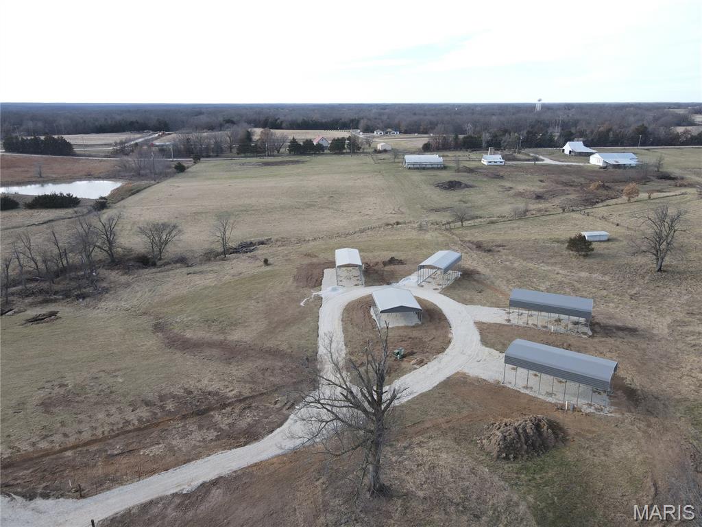 What a Buy! Hookup your RV & get to Lambeau Trail to start your summer fun!  Discover 3 UNRESTRICTED and GATED acres perfectly set up for your Mark Twain Lake adventures. This property features 4 Canopied RV pads, each equipped with full hookups of water, electric, fiber optics, sewer. Canopies are 18' x 40' Legacy metal.
Owning with camping buddies? Then you will love the gathering spot with the 24' x 30' Legacy metal pavilion situated at the center of this great getaway place!
Conveniently located just yards off of Route J, minutes from Jellystone Park and the Water Zone.  Plus all the wonderful amenities of Mark Twain Lake's Ralls County side like  Spalding Recreation Area & Beach, Clarence Cannon Dam, Warren G. See Spillway, Ray Behrens Recreation Area, Blackjack Marina.  Come enjoy this private Monroe City, Ralls County, Missouri group getaway spot. Let it become YOUR private RV retreat, or explore income-producing potential.  Schedule your showing today and experience everything this sought-after area has to offer! See it! Love it! Own it!