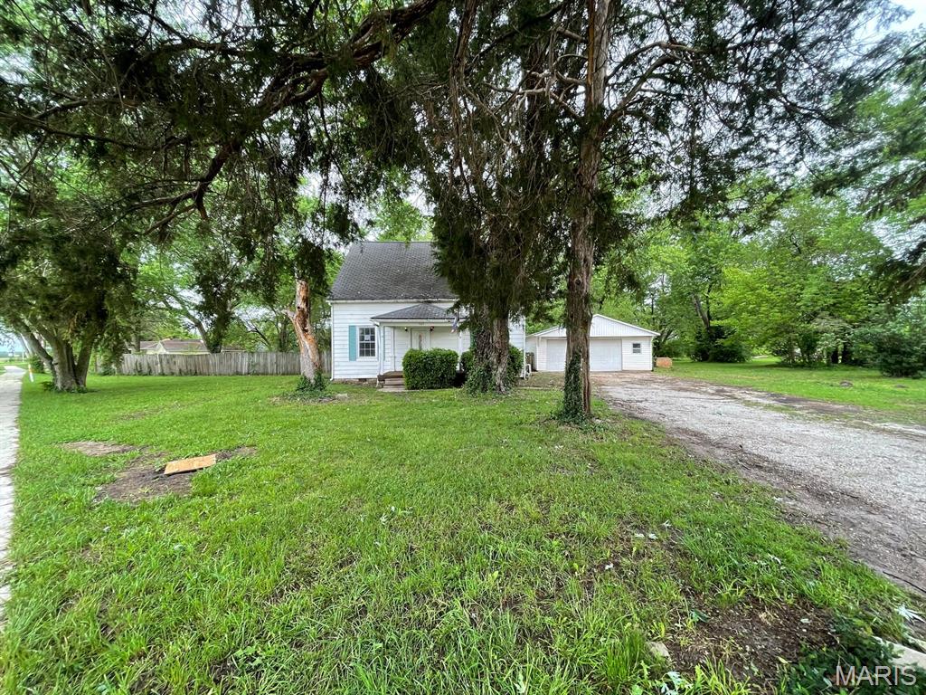 Welcome to 605 S Edwardsville Rd in Worden! This charming 4-bedroom home offers a spacious and functional layout with plenty of room for everyday living. The main level features a comfortable living room, dedicated dining room, and an inviting kitchen, along with a primary bedroom complete with a private 3/4 bath. A full hall bathroom and convenient rear laundry/mudroom add to the home's practicality and appeal. Upstairs, you'll find three additional bedrooms, providing flexible space for family, guests, hobbies, or a home office. Outside, enjoy relaxing on the covered front porch or entertaining on the backyard patio overlooking the large, partially fenced yard. The property also includes a detached 2-car garage for parking, storage, or workshop space. Situated in the welcoming community of Worden, residents enjoy small-town charm with convenient access to schools, local parks, dining, and nearby commuting routes to the Metro East and St. Louis areas. This property offers a great combination of space, functionality, and outdoor enjoyment.  This property may qualify for Seller Financing (Vendee). If Property was built prior to 1978, Lead Based Paint Potentially Exists Buyer and/or buyer agent to verify all MLS data.  ALL  information is deemed reliable but is not guaranteed and should be verified by the buyer and/or buyers agent before making an offer.