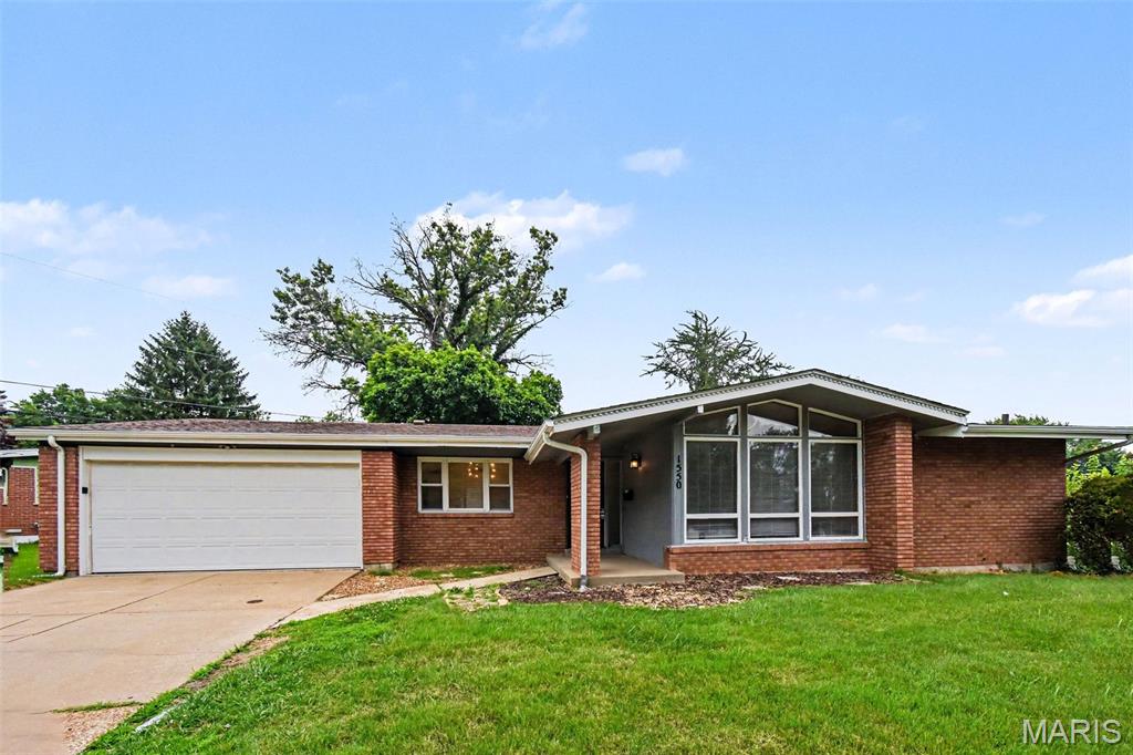 This beautiful 4-bedroom, 2-bathroom home offers a wonderfully functional layout packed with versatile living spaces and exceptional everyday utility. The main level welcomes you with a practical kitchen equipped with durable, easy-to-clean laminate countertops designed for stress-free meal preparation and effortless daily maintenance. A major standout feature of this property is the finished basement, delivering a massive bonus space that is absolutely ideal for a home theater, children's playroom, personal gym, or secondary family room. The living space transitions seamlessly outdoors to a spacious backyard, creating a fantastic private canvas that is ready for gardening, pets, or relaxing weekend barbecues. Complete with an attached 2-car garage providing secure parking and extensive extra utility storage, this home is thoughtfully optimized for a comfortable and highly flexible lifestyle.