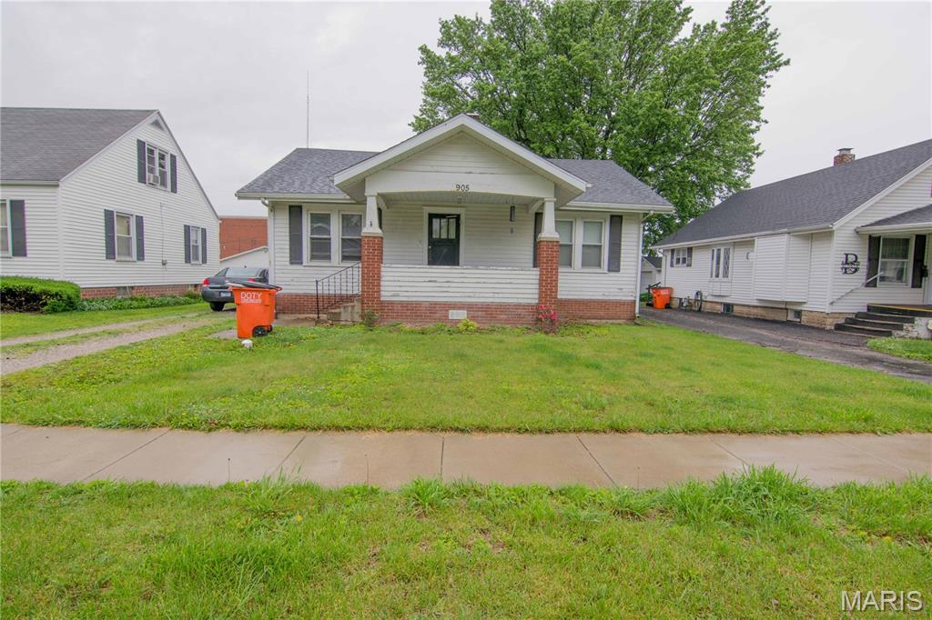 Perfect location for this 2-bedroom, 1-bathroom home! Conveniently situated right next to the hospital and within walking distance to local schools and the park, this property offers plenty of potential in a highly desirable location. Inside, you'll find hardwood floors throughout much of the home, along with good-sized bedrooms that provide comfortable living space. A brand-new roof installed this year adds peace of mind for the next owner. The home also features a single-car garage and a basement, offering plenty of additional storage space. Being sold as-is, this property is ready for its new owner to add their personal touch and make it their own. Call today to schedule your private showing!