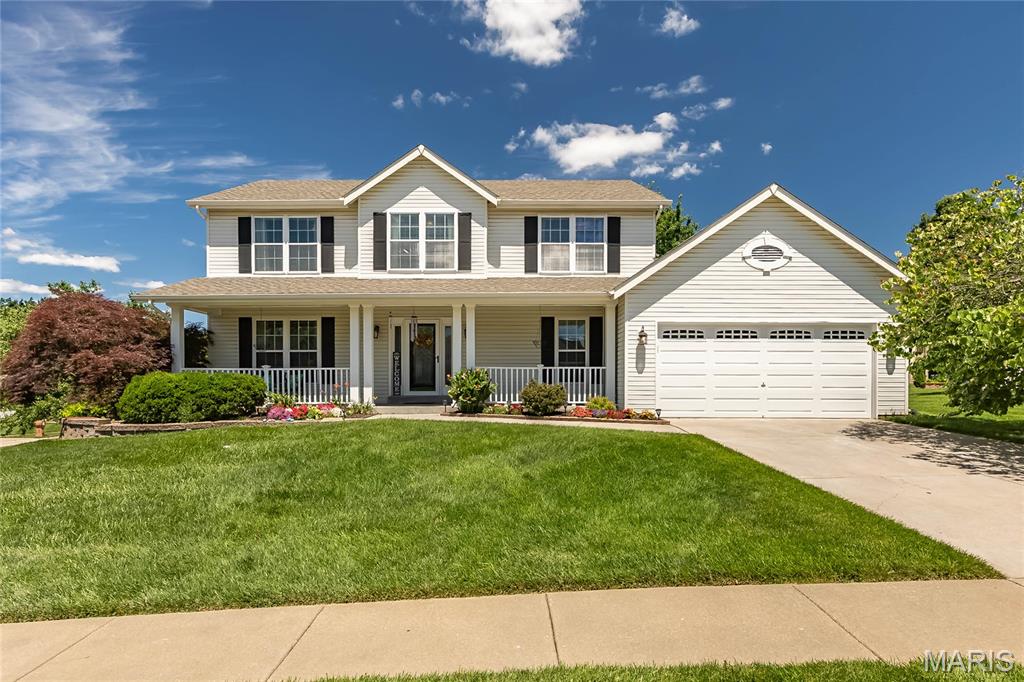 Nestled on a beautifully landscaped corner lot in highly sought-after Cottleville, this immaculately kept two-story home offers the perfect blend of luxury and privacy. Mature trees frame a generous yard, creating your own personal oasis. Inside, the spacious family room invites you to unwind by the cozy wood-burning fireplace framed by elegant bay windows. The kitchen is a chef’s delight, boasting updated appliances, stylish tile backsplash, rich hardwood flooring, a massive pantry, and plenty of cabinet space, with a convenient main-floor laundry room just steps away. Upstairs, the expansive primary suite serves as a peaceful retreat with its vaulted ceilings, a large walk-in closet, and a private full bath featuring double sinks. Three additional bright bedrooms and a second full bath round out the upper level. The finished walk-out lower level is built for fun, offering a rec room perfect for entertaining and built-in shelving for effortless storage. Step outside to enjoy the custom paver patio, deck, and built-in irrigation system—or spend your summer cooling off at the neighborhood pool!