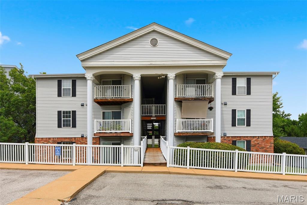 Welcome to this delightful main-level condominium in desirable Somerset Place! With an assigned parking space conveniently located right outside your door, this lovingly maintained home is truly move-in ready.  Recent updates include bathrooms, kitchen countertops, appliances, and flooring, offering modern comfort and style throughout. The cozy living room features a sliding glass door that opens to a private balcony overlooking mature trees, creating a peaceful setting to enjoy your morning coffee or unwind at the end of the day. A personal storage area, accessible directly from the balcony, provides valuable extra space. The eat-in kitchen flows seamlessly into the living area and offers abundant cabinetry along with a convenient pantry for additional storage. The primary suite features a walk-in closet and an updated bathroom with a shower. Laundry is effortless with the newer in-unit stacked washer and dryer. The second bedroom, complete with its own walk-in closet, is ideal for family, guests, or a home office. An updated second full bathroom with a tub/shower combination provides comfort and convenience for visitors.  For added peace of mind, a one-year home warranty is included. Ideally located near grocery stores, banking, healthcare facilities, shopping, and dining, with easy access to Interstate 270, this home offers exceptional convenience. All of this is situated within the highly acclaimed Lindbergh School District.  Don't miss this opportunity—come discover your new happy place today!