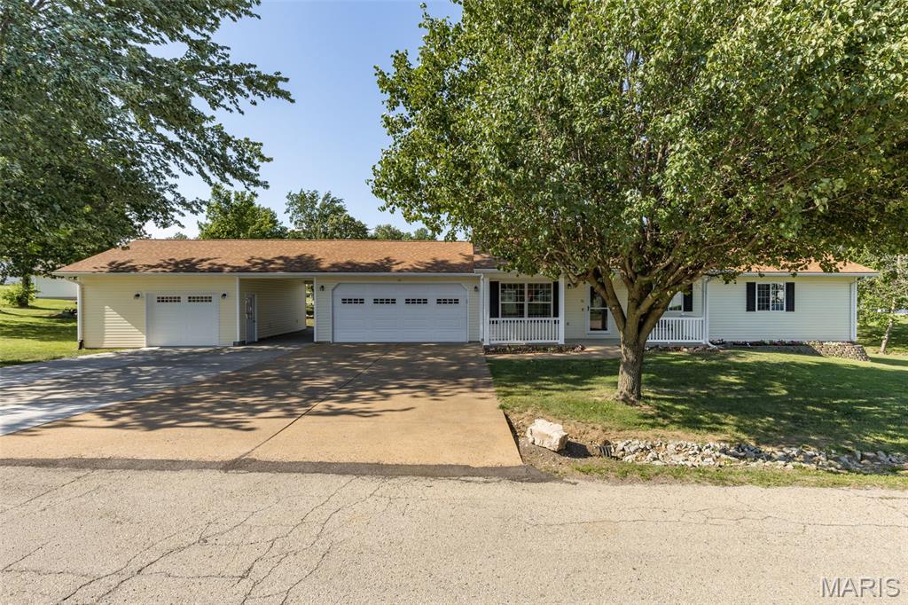 This is the one you’ve been waiting for in Hunters Ridge (situated between Park Hills and Farmington), this beautifully updated ranch-style home offers one-level living at its finest. With 3 bedrooms, 2 full baths, and 1,580 sq ft of thoughtfully designed space, this home checks every box. 
Step inside and you'll immediately notice the vaulted ceilings and open-concept living area, bathed in natural light and finished with luxury vinyl plank flooring throughout. The spacious living room flows seamlessly into the updated kitchen, featuring all new cabinets, countertops, a center island bar, recessed lighting, and a full suite of stainless steel appliances which includes a refrigerator with a built-in ice machine. A separate dining room (11x19) provides the perfect space for entertaining or family gatherings, and leads directly out to the comfortable 12x20 screened-in back porch.
The generous master bedroom includes a large walk-in closet (12x5) offering the kind of storage space you didn't know you needed. A dedicated pantry and ample storage throughout the home mean everything has its place. The conveniently located main-level laundry room houses a front-loading washer and dryer and a water softener, with extra space for all your cleaning supplies.
Car enthusiasts and hobbyists will love the impressive garage setup…an attached 2-car garage with a utility sink, PLUS an additional heated and insulated 1 1/2 car garage complete with a built-in workbench and shelving. The concrete driveway even doubles as a great basketball court, and the large .546-acre yard includes a storage shed for even more space. 
Don't miss this one — call today to schedule your showing!