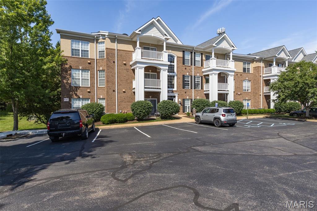 Welcome to this charming move-in-ready condo located in the heart of Creve Coeur. A safe and quiet gated community features a 2nd floor 2 Bed/ 2 Full Bath. Enter an inviting living/dining combo complete with cozy fireplace. Sliding glass doors lead to beautiful private balcony with relaxing view. Bedrooms are arranged in a divided floor plan. Master includes a large walk-in-closet; master bath has jetted bathtub /separate shower. Laundry room located off the kitchen along with ample storage within the unit. Recent improvements: freshly painted, water heater (2026), quartz hard surface counters in kitchen (2026), HVAC maintained every 6 months, freshly cleaned carpets. Refrigerator included. Unit features covered, secure underground parking garage with assigned parking and storage space, with elevator access. Mill Crossing residents enjoy a community pool and workout facility; HOA covers maintenance of building exterior, landscaping, snow removal, and access to club house, pool, exercise room/sauna, and utilities (water, sewer, gas, trash/recycle.) Conveniently located in Parkway School District near major highways, stores, restaurants and nearby hospital. Pets under 30 pounds are welcome in this Community.