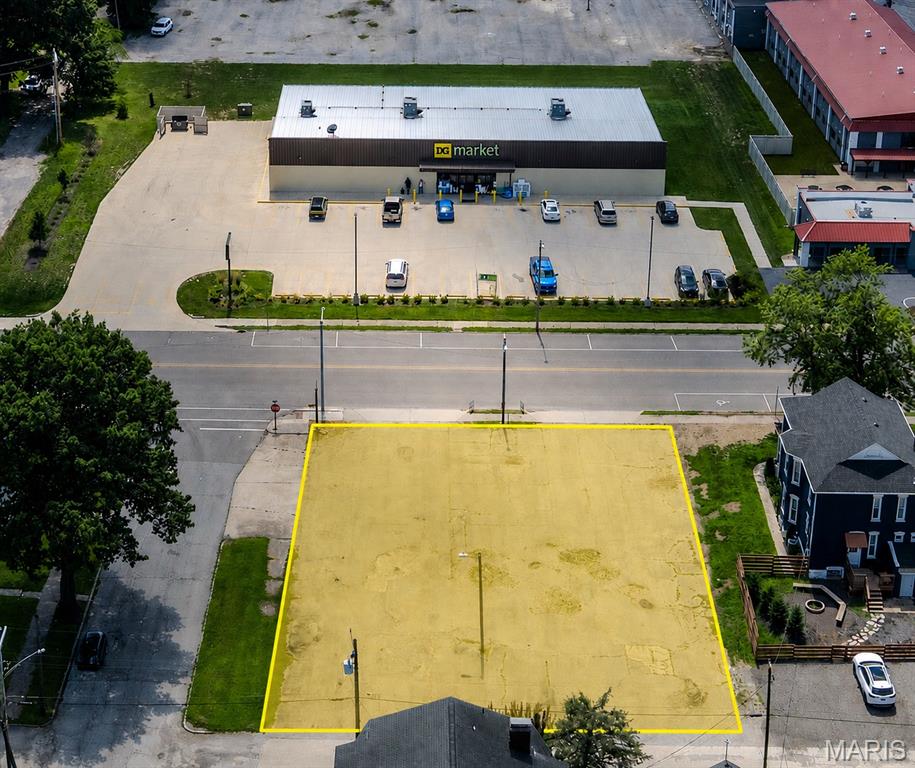 Commercial land opportunity at 2103 W Main St in Belleville. This approximately 0.29-acre paved corner parcel offers approximately 100 feet of frontage along West Main Street and exposure to approximately 5,400 vehicles per day. Zoned C-1 Light Commercial and conveniently located at W Main St and N 21st St, directly across from DG Market and approximately one block from the Southwestern Illinois College Justice & Workforce Development Campus. Approximately 100' x 125'. Excellent opportunity for an owner-user, investor, or commercial development. Offered at $35,000. Buyer to independently verify zoning, permitted uses, utilities, dimensions, and all property information.