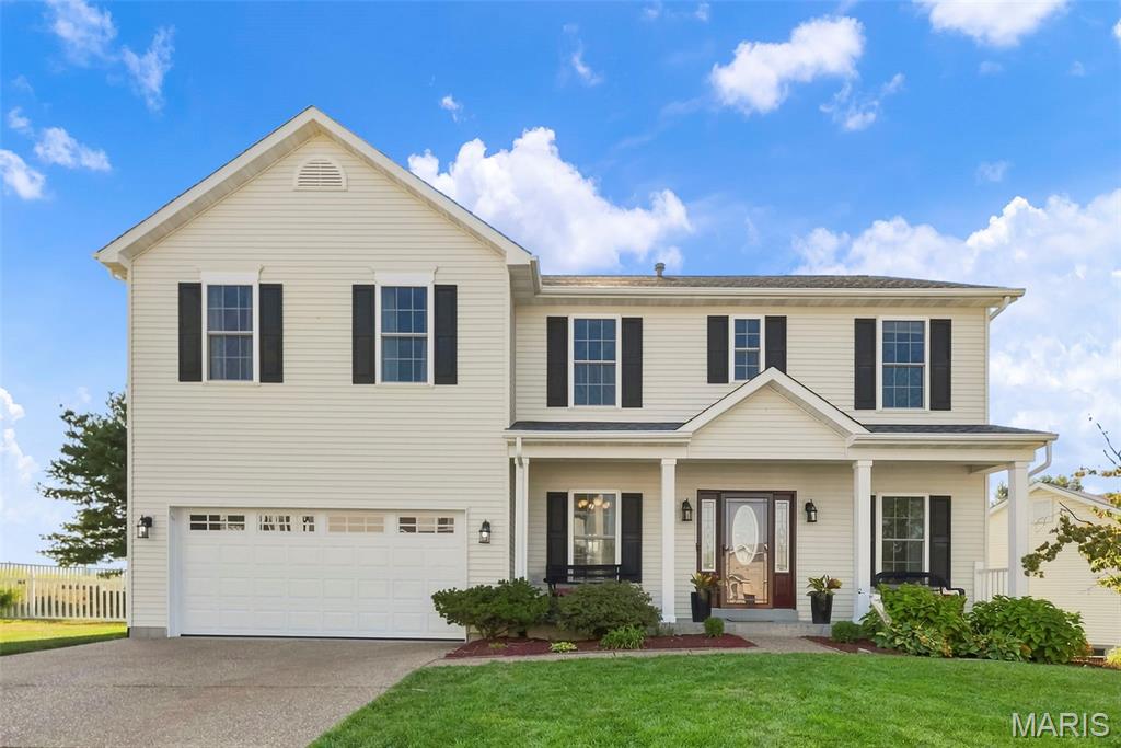 Welcome home to this spacious 4-bedroom, 3.5-bath two-story tucked away on a cul-de-sac in the Villages of Dardenne and located in the Fort Zumwalt West School District. With a fully finished basement, multiple living spaces, beautiful custom details, and an open backdrop of common ground and farmland, this home offers plenty of room to live, gather, and entertain.
The kitchen is truly the heart of the home, featuring beautiful custom cabinetry, built-in wine storage, white quartz countertops, a center island, and a corner sink overlooking the backyard. Just off the kitchen, the breakfast room offers easy access to the fenced backyard and patio. The main level also features a separate dining room with wainscoting, a versatile family room that would make a wonderful home office, playroom, or additional sitting area, and a light-filled living room with a bay window. A wood-burning fireplace serves as the focal point of the living room, surrounded by custom built-in shelving and cabinetry.
Upstairs, a spacious loft connects all four bedrooms and provides even more flexible living space. French doors welcome you into the generously sized primary suite with plenty of room to arrange your furniture and create your own private retreat. The primary bathroom features a double vanity, standalone soaking tub surrounded by corner windows, and access to an impressive walk-in closet complete with a built-in organization system featuring shelves, hanging racks, and drawers. Three additional bedrooms and a spacious hall bathroom with double sinks and a tub/shower combination complete the second level.
The fully finished basement adds another level of living and entertaining space with a custom wet bar featuring a mini refrigerator, sink, and bar seating. There is plenty of additional finished space to configure for movie nights, game days, hobbies, or gatherings, along with a full bathroom and an office/bonus room. A small unfinished storage area with built-in wood shelving provides convenient space for items you want tucked away.
Step outside to enjoy the fenced backyard and patio with room for entertaining, relaxing, or simply enjoying the peaceful scenery. With common ground and open farmland beyond the backyard, you'll love having a beautiful open view right outside your door.
Living in the Villages of Dardenne also means enjoying an impressive collection of neighborhood amenities. The HOA offers access to three community pool areas, including a lazy river pool and a large family-friendly aquatic area featuring beach-style walk-in entry, a splash pad, and plenty of space for summer fun. The neighborhood is also home to a golf course with a clubhouse and restaurant, adding even more recreation and entertainment right within the community.
From the custom kitchen and flexible living spaces to the finished basement, peaceful backyard setting, and incredible neighborhood amenities, this Villages of Dardenne home has room for every part of your lifestyle. Don’t miss your opportunity to make it yours—schedule your showing today!