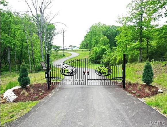 Discover a rare opportunity to own a private 5-acre homesite in an exclusive gated community in beautiful St. Charles County. Tucked away on Hidden Sanctuary, this exceptional property offers the perfect blend of seclusion and convenience, just 15 minutes from shopping, grocery, and everyday essentials. Bring your own builder and create the custom home you’ve always envisioned within the highly sought-after Francis Howell School District. Far enough removed from the hustle of daily life, every day here feels like a vacation surrounded by peace, privacy, and nature. This homesite offers the perfect blend of mature hardwoods, open pasture, a dry creek, and a charming fishing pond, ideal for nature lovers and those seeking peace and privacy. With a natural layout suited for a walk-out home, your dream build starts here. An adjoining 5-acre lot is also available, offering the rare chance to expand to 10 acres—don’t miss this extraordinary opportunity to secure your dream homesite before it’s gone.