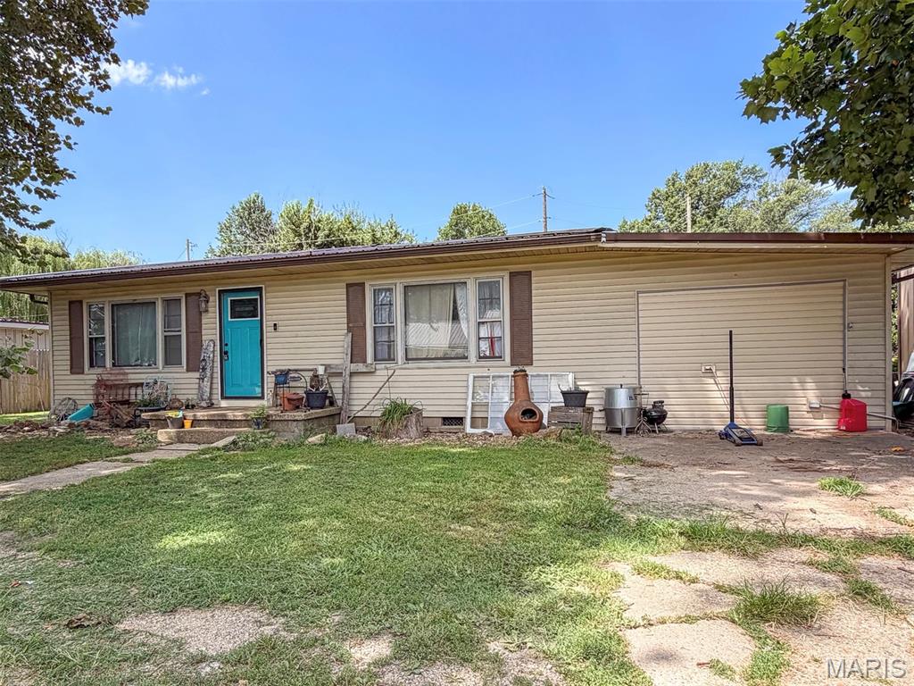 Set on a peaceful corner lot, this 4 bedroom, 2 bath home offers a spacious and functional layout with LVP flooring throughout most of the home. The large kitchen has great cabinet and counter space, while the primary bedroom is located on its own side of the home and includes a walk-in closet. Outside, enjoy the rear porch and nice backyard, along with a metal shop and garden shed for additional storage. With a metal roof and so much to offer both inside and out, this home is ready for its next owner.