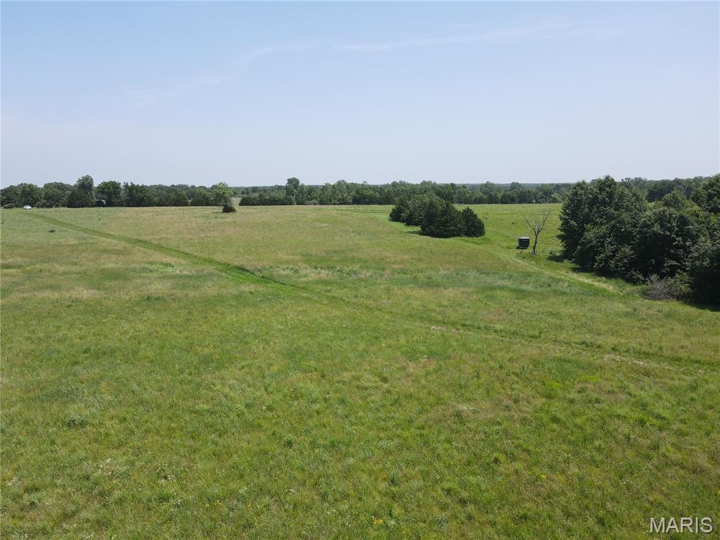 Incredible opportunity to own **20± acres in one of the most desirable Route N locations**, just 5 minutes south of Monroe City and perfectly positioned on the Indian Creek side of Mark Twain Lake! Whether you are looking for a recreational getaway, hunting tract, investment property, future homesite, or lake-area escape, this property checks all the boxes.

The land is mostly flat with a touch of gentle slope, offering a beautiful blend of open acreage and woods. Approximately 5 acres are tillable and currently in CRP, with the balance in wooded cover that attracts abundant wildlife, including whitetail deer and turkey. With an NCCPI of 61.3 and Armstrong soil type, this tract offers strong land value in a highly sought-after area.

Enjoy hard-surface road frontage along the east side, with rural water at the road, plus electric and fiber available. A small amount of wetland off an inland lake adds natural character and wildlife appeal. Route N Boat Ramp is just minutes away, and Indian Creek Marina is within approximately 15 minutes, making lake access quick and convenient. The property is surrounded by open fields and wooded acreages and backs to open ground, creating the perfect mix of privacy, scenery, and accessibility.

Located in the Monroe City School District. A rare Route N acreage like this does not come along often!