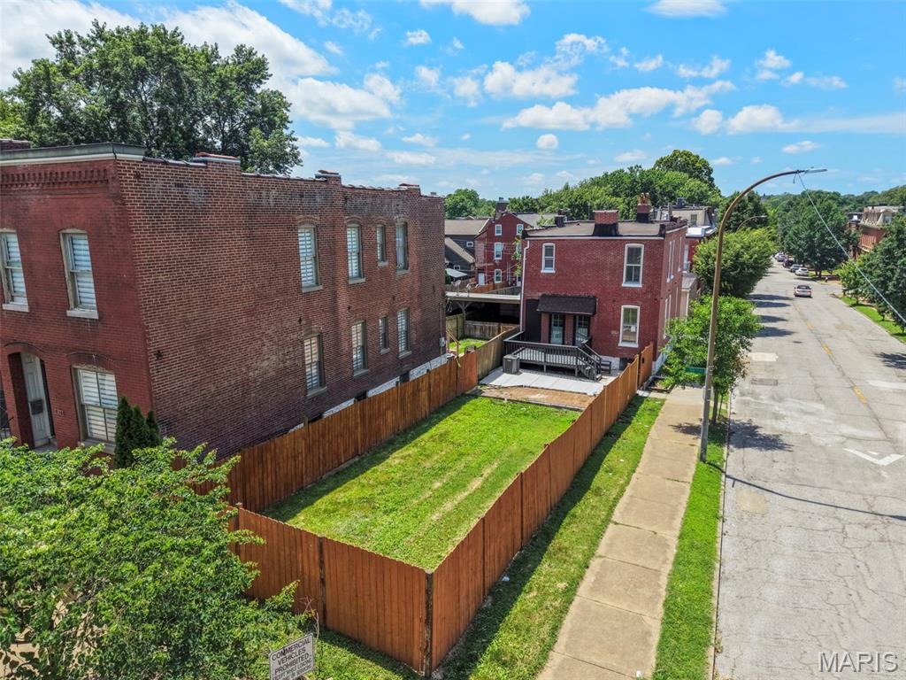 Welcome to 1810 Utah Street, a fully renovated Benton Park gem situated on an oversized double lot. This stunning 4-bedroom, 2.5-bath home seamlessly blends historic St. Louis character with modern finishes and thoughtful design. Step inside to discover an open and inviting floor plan featuring luxury flooring, spacious living areas, and a beautifully updated kitchen complete with quartzite countertops, custom cabinetry, stainless steel appliances, and a large center island perfect for entertaining. The home's extensive renovation includes updated systems, stylish fixtures, and high-end finishes throughout. The spacious primary suite offers a true retreat with a spa-inspired bathroom featuring a custom tiled shower, freestanding soaking tub, dual vanity, and designer touches. Generously sized secondary bedrooms provide ample space for family, guests, or a home office. Outside, you'll find one of the property's most unique features, an oversized fenced double lot offering a rare amount of yard space in Benton Park. Enjoy outdoor gatherings on the newly constructed deck and expansive concrete patio, with plenty of room for recreation, gardening, pets, or future possibilities. Located just minutes from Benton Park, Soulard, Cherokee Street, and some of St. Louis' best restaurants, coffee shops, and entertainment, this move-in-ready home offers the perfect combination of historic charm, modern convenience, and exceptional outdoor space.

Don't miss this rare opportunity to own a beautifully renovated home on a double lot in one of St. Louis' most sought-after neighborhoods.