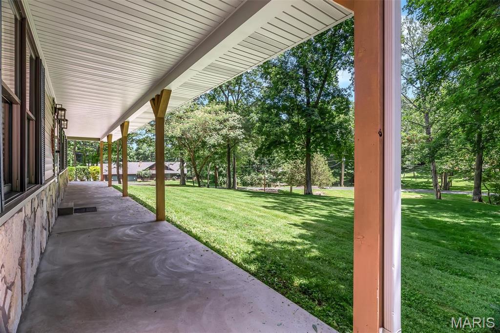 Welcome to 2469 Wild Valley Drive! Meticulously maintained and nestled on approximately 2 beautiful acres, this exceptional ranch offers the perfect blend of comfort, quality, and peaceful surroundings. Step inside to a stunning vaulted living room accented by white oak hardwood floors throughout the main living areas and 3/4" hickory hardwood flooring in all bedrooms. The refreshed kitchen is designed to impress with quartz countertops, soft-close cabinetry, under-cabinet lighting, and a spacious pantry. The primary suite features a beautifully updated bath with radiant-heated floors, a double vanity, and a relaxing retreat feel. A convenient main-floor laundry room includes a built-in desk area and adjoining half bath. The finished lower level boasts 9-foot ceilings, a kitchenette, full bath with fun custom tile finishes, and its own exterior entrance—ideal for guests, multi-generational living, or entertaining. Outside, unwind on the patio while enjoying the surrounding nature, with additional features such as a detached shed, a garage service door, and room to roam on this picturesque property.