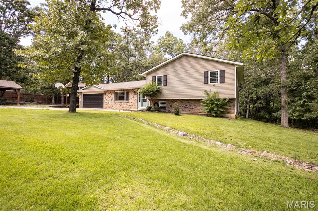 Escape to your own private retreat with this beautiful 4-bedroom, 3-bath home tucked away on a spacious, secluded 1.56 acres in Waynesville. Thoughtfully updated, the recently renovated primary bathroom offers a luxurious touch, while the home’s generous floor plan provides plenty of space for both everyday living and entertaining.
Step outside and enjoy everything this property has to offer—from relaxing mornings in the screened-in porch with its cozy wood stove to evenings gathered around the backyard fire pit. Car enthusiasts, hobbyists, and outdoor adventurers will appreciate the ample parking and storage, including a 2-car attached garage, a detached 2-car carport with a storage room, and a dedicated RV carport.
Offering the perfect blend of comfort, privacy, and functionality, this exceptional property is ready to welcome you home. Schedule your private showing today!