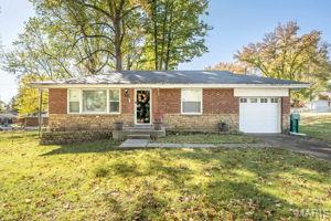Charming Brick 2 Bedroom Home with Garage. This well- maintained brick home offers timeless curb appeal and comfortable living. Features two spacious bedrooms and one full bath, original hardwood floors, the layout is both function and inviting.   The solid brick exterior provides durability, blends simplicity, warmth, and practicality in a desirable setting