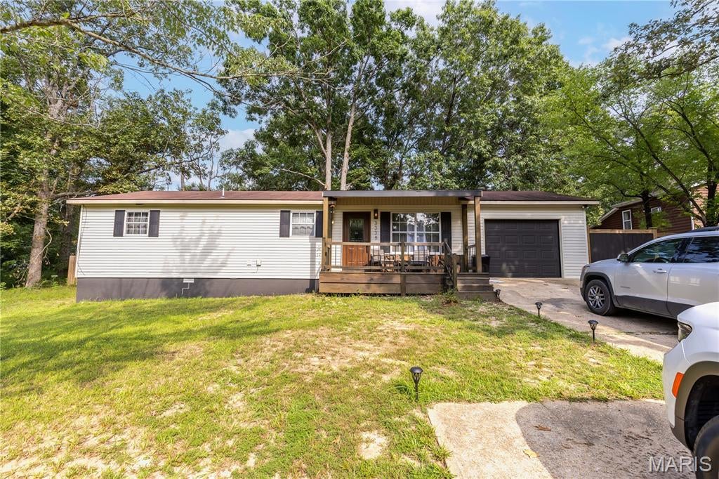Welcome home to this beautifully renovated 3-bedroom, 2-bath home in Poplar Bluff! Updated throughout and move-in ready, this home offers a fresh, modern feel while still being warm and inviting. The kitchen features updated cabinetry, countertops, stainless steel appliances, and plenty of workspace, opening into a comfortable living area with great natural light.

Step outside and you’ll find one of the best features of the property—a huge fenced-in backyard with mature trees and tons of room for entertaining, pets, kids, gardening, or simply enjoying your own private outdoor space. A covered front porch adds even more charm and gives you the perfect spot to sit and unwind.

With a fully renovated interior, 3 bedrooms, 2 full bathrooms, an attached garage, and an oversized fenced yard, this home is ready for its next owner. Schedule your showing today!