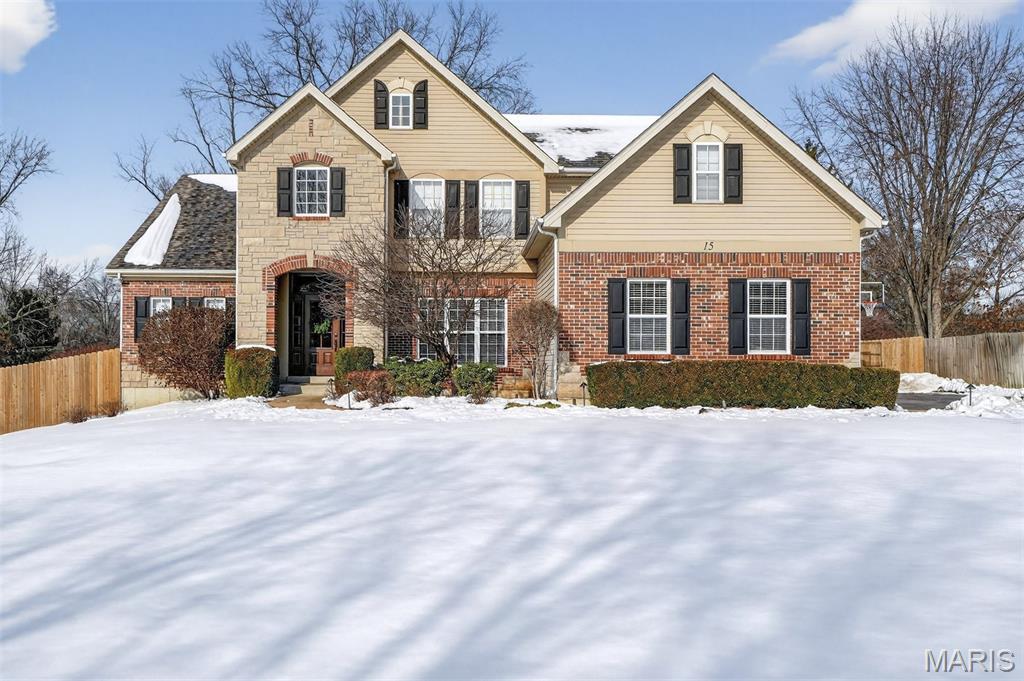 Life here unfolds with a certain grace—sunlit mornings rising into vaulted spaces, evenings drawn close by the glow of the fire, and weekends that drift effortlessly from kitchen laughter to patio skies. Beautifully maintained and generously scaled, this 6-bedroom, 4.5-bath home in the award-winning Ladue School District offers rare flexibility, thoughtful updates, and the kind of flow that makes everyday living feel quietly elevated. White oak floors lead you through open, light-filled rooms, where soaring ceilings, designer lighting, and two fireplaces set the scene for both intimate nights and joyful gatherings. At the heart of the home, a showstopping kitchen invites connection: Cambria quartz countertops, an oversized island, custom cabinetry, stainless appliances, and a striking chevron backsplash—opening seamlessly to the hearth room and, through French doors, to the patio beyond. The formal dining room makes celebrations feel effortless, with a butler’s pantry poised for hosting, serving, and savoring. Daily rhythms are beautifully supported with a main-floor laundry room, built-in cubbies for the comings and goings of life, and an updated powder room placed with ease in mind. The vaulted main-floor primary suite is a true retreat at day’s end—complete with dual walk-in closets and an updated bath featuring quartz vanities, a soaking tub, and separate shower for long exhale moments. Upstairs, three generous bedrooms and beautifully updated baths offer comfort and privacy, along with flexible space ready to become a study nook, creative corner, or simply the storage you’ve always wished for. The finished lower level expands the story—made for movie nights, game days, and extended stays—with a spacious rec room, kitchenette/bar, two bedrooms with egress windows, and a full bath ideal for guests or multigenerational living. And outside, the fully fenced backyard becomes its own destination: a stamped concrete patio beneath a pergola, built-in kitchen and grill, landscape lighting that glows into the evening, and room to relax, dine, and gather under open sky. With major systems updated, smart home features in place, and a three-car garage (EV charger ready), this home pairs comfort and confidence with timeless appeal—a place designed not just to live, but to truly settle in… and stay awhile.