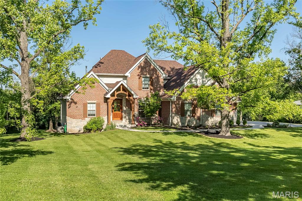 Built in 2021 & overflowing with charm & architectural detail, this stunning home offers over 4,000+ sq ft of beautifully designed living space on a private and safe .94-acre lot. From the picturesque patio to the sparkling pool and fully fenced backyard, you can enjoy the sunset from the privacy of your deck or master balcony. Inside you will find 5 bedrooms, 5 full bathrooms and 1 half bath. The kitchen features a huge island, ss appliances, gas cooktop, & a walk-in pantry. The eat-in kitchen also has countertop seating with a slider to the patio! The main floor primary suite features an outdoor seating area, plus an elegant primary bath with dual vanities. You will find beautiful hardwood floors throughout the home & natural light pours in through the oversized windows. The finished LL has an additional bedroom & bath, a media room, a wet bar featuring Brazilian countertops & walks out to the pool & fire-pit area. Main floor laundry, 3 car garage, irrigation system & a private office top off this perfect home. Perfect for neighborhood walks, running or biking around. One mile from two major highways, (270 & 40), close proximity to all private schools including MICDS, John Burroughs, Whitfield and minutes to wonderful restaurants in Creve Coeur, Frontenac and Clayton.