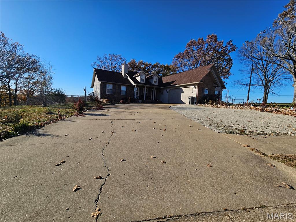 Located in the highly regarded Woodridge subdivision, close to I-44 and FLW, this three bedroom ranch has so much to offer! Enter through the front door and immediately notice the custom wooden accent wall. The living room offers a gas fireplace,with gas line available right off  the road. The kitchen and dining space provide and open concept feel,along with access to the back deck that has a beautiful gazebo to relax under and watch the sunset or have your morning coffee. As you walk down the hall, find a large laundry room, completed with deep utility sink and cabinets for all your laundry needs. The master suite captivates you with wooden accent wall, dream walk-in- closet and closet for him. For the master bathroom you have his and hers double sinks and separate shower with the dream jetted tub to relax in. Across the home,find two bedrooms,each with ceiling fans, and a common hall bathroom. This home boasts curb appeal and fruit trees. The storage shed will convey with the home also the rain water storage container in the backyard and water softener.