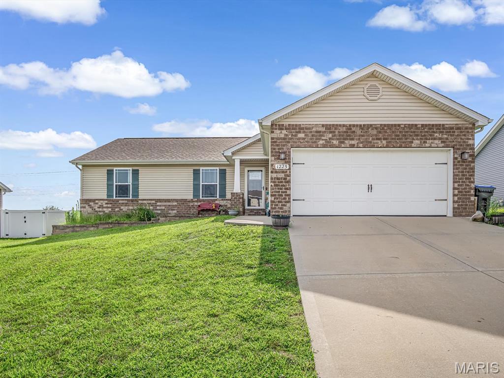 Welcome to 1225 Sherwood Ln in the desirable Country Club Hills subdivision of Waterloo, IL! Built in 2016, this well-maintained home offers 3 bedrooms, 2 full bathrooms, and a bright open floor plan designed for comfortable everyday living and effortless entertaining. The spacious living area flows seamlessly into the kitchen and dining space, creating an inviting atmosphere for family gatherings and guests alike.
The full unfinished basement provides endless possibilities for future living space and includes an egress window along with a bathroom rough-in, making it ready for your personal touch. Situated on a lot that backs to an open field, you'll enjoy added privacy and peaceful views right from your backyard.
Conveniently located in one of Waterloo's most sought-after neighborhoods, this home offers the perfect combination of modern construction, functional layout, and room to grow. Don't miss your opportunity to make this beautiful property your own—schedule your private showing today!