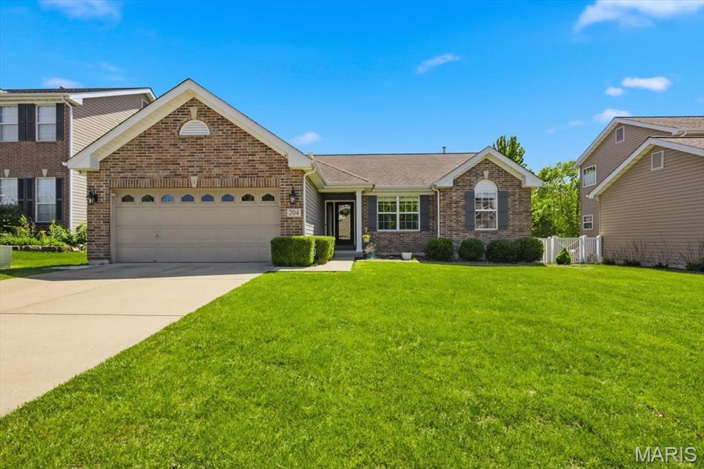 Move-in ready ranch home in the highly desirable Wyndgate subdivision! Enjoy a vibrant community lifestyle complete with a pool, pickleball courts, basketball court, and neighborhood events, all just minutes from top-rated Wentzville schools, shopping, and major highways.

This beautifully maintained open-concept floor plan features a spacious living room with a vaulted ceiling and a cozy gas fireplace. The chef’s kitchen boasts 42-inch cabinets, premium quartz countertops, a timeless tile backsplash, a breakfast bar, and a dedicated coffee station. The adjacent dining area opens directly to the patio equipped with an optional canvas cover for seamless indoor-outdoor living.
The main level offers three bedrooms and two full baths, including a primary suite with a dual vanity and separate shower, plus convenient main-floor laundry. 

Upgrades over the past two years include new air conditioner, fresh paint, new carpeting, modern light fixtures, and a gorgeous new living room ceiling fan. Two new refrigerators, a new microwave, dishwasher, washer and dryer will help you fall in love with the modern condition of the home.

The expansive finished basement nearly doubles your living space, offering a massive family room with a second gas fireplace, a built-in kitchenette/bar area, a bonus room with a closet, a dedicated gym/play space, and a third full bath.
Additional premium features include a flat, fully fenced backyard, an in-ground sprinkler system, and a 2-car garage pre-wired for an EV charger.