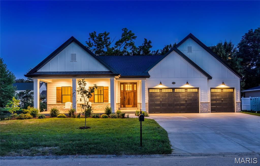 There is absolutely nothing on the market like this luxurious new construction ranch-style home built by Pentrex Development. From the inviting front porch, to the fireplace in the screened in patio, every detail has been well considered and implemented. The grand hall welcomes each guest, drawing them to the main living area where walls of on-trend black windows allow sunlight to drench the home with warmth. Entertaining couldn't be easier with stunning custom cabinetry, double oven, walk-in ingredient pantry, and generously sized island open to both Dining and Great Rooms. Job-finish hardwood, coffered 11' ceiling in Great Room, wired speakers, expansive walk-in closet and soaking tub in wet area of Primary ensuite, two beverage centers, and Main Floor Laundry! The wet-bar provides space for quick refreshments near the Great Room, or invite guests to the lower level where there is an additional beverage bar and more room for mixing and mingling. Walk-out to the screened in patio, to enjoy the gas fireplace, overlooking the backyard filled with trees. With five bedrooms, an office, two entertaining areas inside, and another outside, there is room for absolutely everyone, and just a very short walk to Des Peres Park! What else can you ask for in top-rated Kirkwood Schools?! When should we look for you?