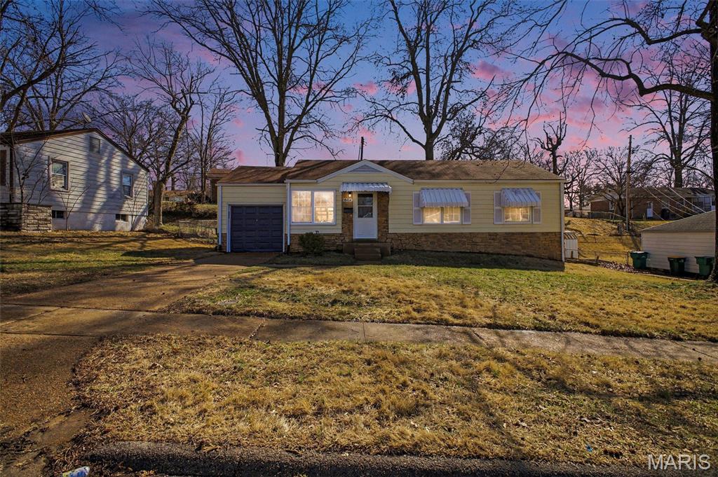 Stop scrolling & feast your eyes on this move-in-ready 1,400+sqft of livable space 3-bedroom stunner with a nonconforming 4th! The hardest decision you'll need to make is whether to spend your time in the updated the massive main level living area or beautifully finished basement quarters. This forever home also conveys a renovated bathroom, kitchen appliances, new lighting, screened-in back porch, attached garage with concrete drive, & fenced-in back yard. If you want a home so nice you'll never want to leave, then set a showing to see this must-see gem with your own eyes & make it yours!