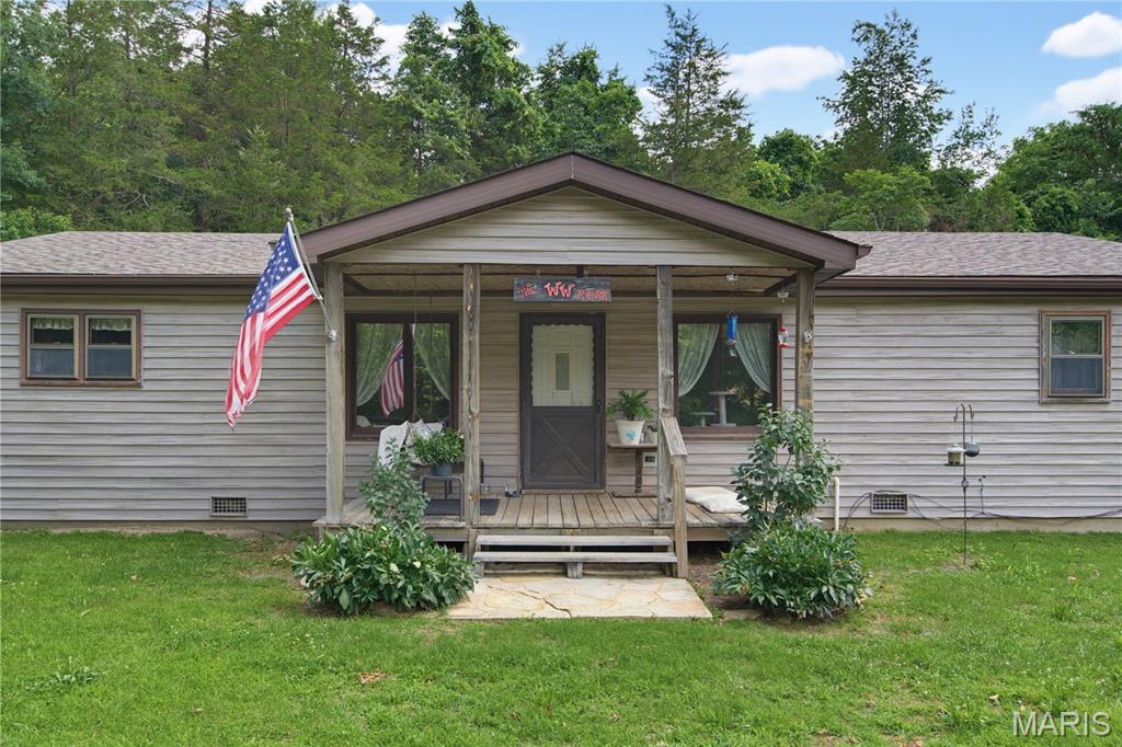 Gorgeous 3-bedroom ranch-style home nestled in the Ozarks of Southern Iron County, just outside of Annapolis, Missouri, situated on 14.58 scenic acres. This beautiful single-family home offers the perfect blend of comfort, privacy, and country charm. The property features an impressive barn with an upper level currently used for storage, ideal for equipment, hay, or additional workspace. The setting is truly picturesque, with lush open fields surrounding the home and a stunning spring behind the house, fed by an artesian well. Enjoy peaceful mornings with a cup of coffee while relaxing on the inviting front porch swing. Experience country living at its finest, with the serenity of rural life just minutes from town approximately 4 miles from Annapolis and only 20 minutes to shopping and amenities in Piedmont, the Clearwater Lake area, or to Ironton. 
With ample acreage suitable for horses or cattle and wooded areas ideal for hunting, this property offers exceptional recreational opportunities. Abundant wildlife, including deer and turkey, frequent the area, with visible deer sign throughout the property. A must-see property to truly appreciate all it has to offer.
