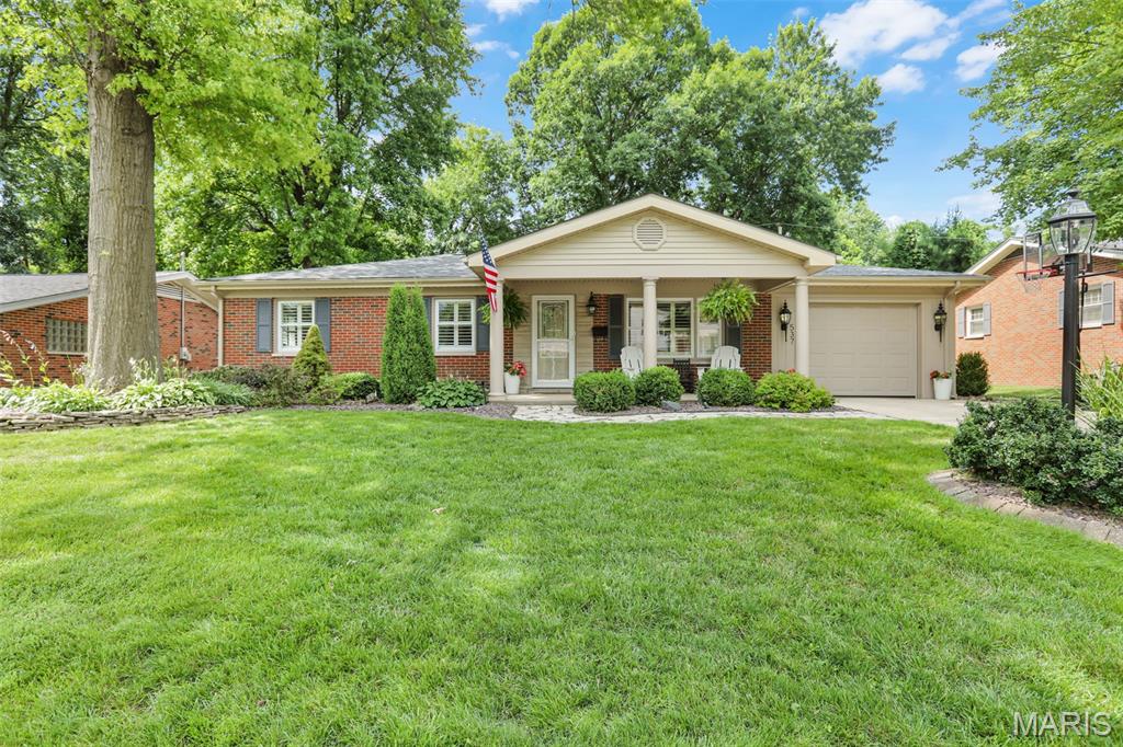 Welcome to the highly sought-after Grandview Place subdivision in the heart of Edwardsville! This beautifully maintained brick home offers timeless character, quality craftsmanship, and quality upgrades throughout.
Built in 1955 and meticulously cared for over the years, this spacious home features 4 bedrooms and 2 full bathrooms, blending classic charm with modern comfort. The inviting main level offers warm, welcoming living spaces highlighted by two fireplaces, while the fully finished basement provides exceptional additional living space complete with 4th bedroom, full updated bathroom, a perfect for entertaining, relaxing, or creating recreation area, and storage space. One of the home's standout features is the stunning oversized sunroom, filled with natural light and offering beautiful views of the backyard year-round. Step outside to discover a private outdoor retreat with extensive landscaping, mature plantings, and plenty of space to enjoy peaceful mornings, family gatherings, or evening relaxation. Located in one of central Edwardsville's most desirable neighborhoods, this home combines established neighborhood charm with convenient access to  the bike trail, schools, parks, shopping, dining, and all that Edwardsville has to offer. A rare opportunity to own a lovingly maintained brick home with space, character, and an exceptional setting. Refrigerator, Kitchen Exhaust Vent, Dishwasher 2026. Roof 2025. Garage Door & Opener 2023. Water Heater 2018. HVAC 2014