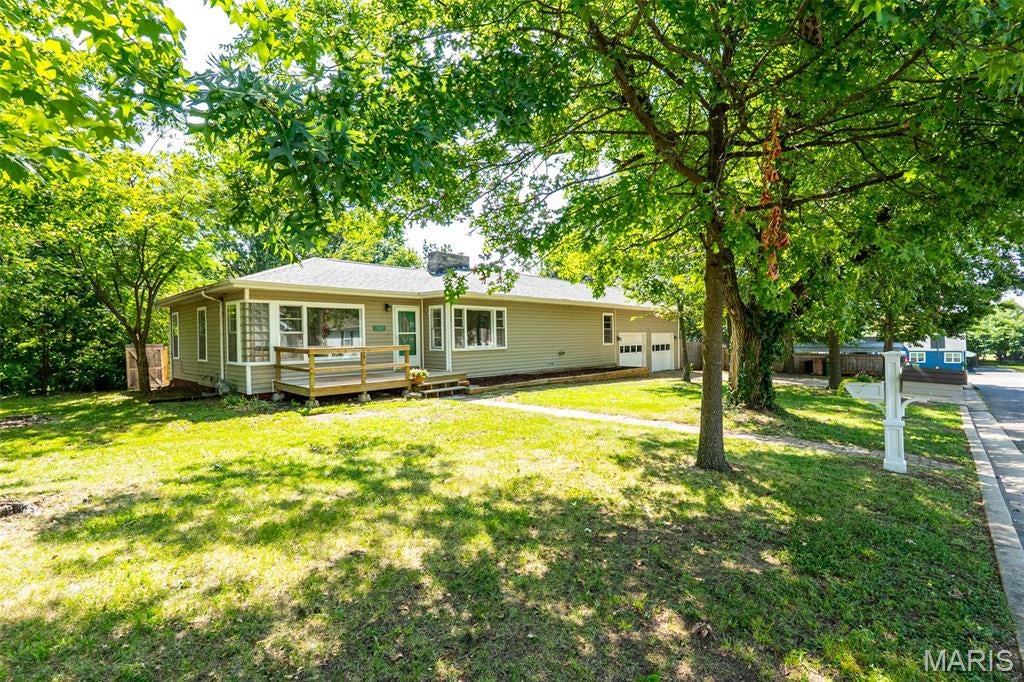 Welcome to 102 Poe Drive - a charming ranch, conveniently situated in the heart of Rolla. The property has had many updates in the last few years, including a new roof and HVAC! Inside you'll find 3 bedrooms, 2 bathrooms, updated kitchen (new floors, counters, backsplash, oven), large separate dining room with built in bookcase & picture windows, hardwood floors throughout most of the home, and a full, walk-up basement for storage or convert to extra living space. The corner lots features a spacious front & side yard, with a private backyard that is completely fenced in, parking, and a two car garage complete with attic space of its own. You really don't want to miss this gem. UPDATES, SPACIOUS, QUIET & CONVENIENT LOCATION!!